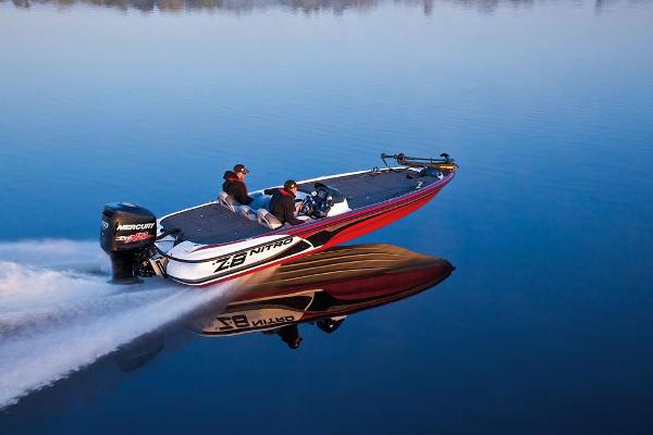 Manufacturer Provided Image: 2013 Nitro Z-8 boat speeding on calm water, creating a clear reflection.