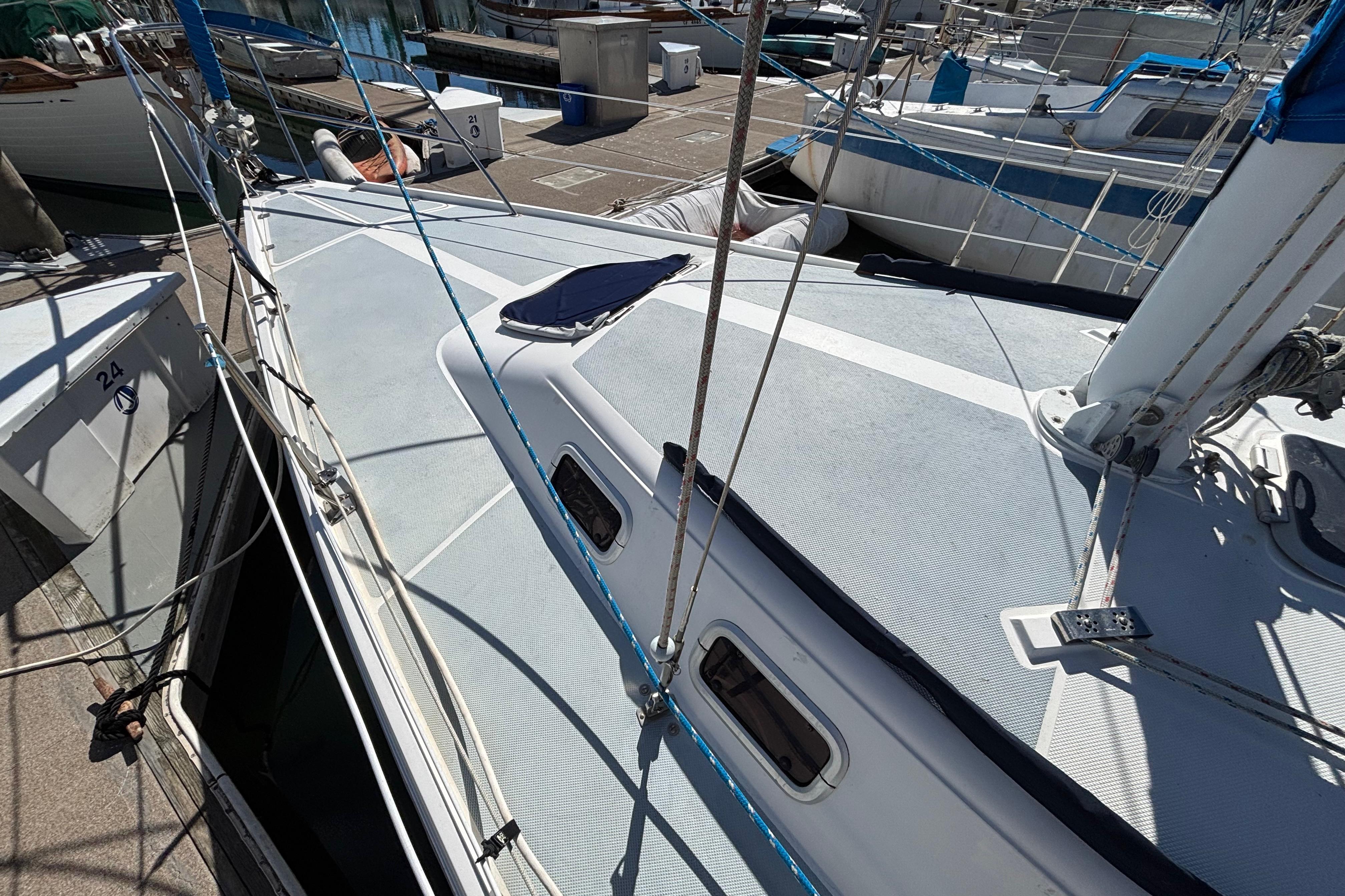 1988 Catalina 34 sailboat docked, showcasing deck and rigging details.