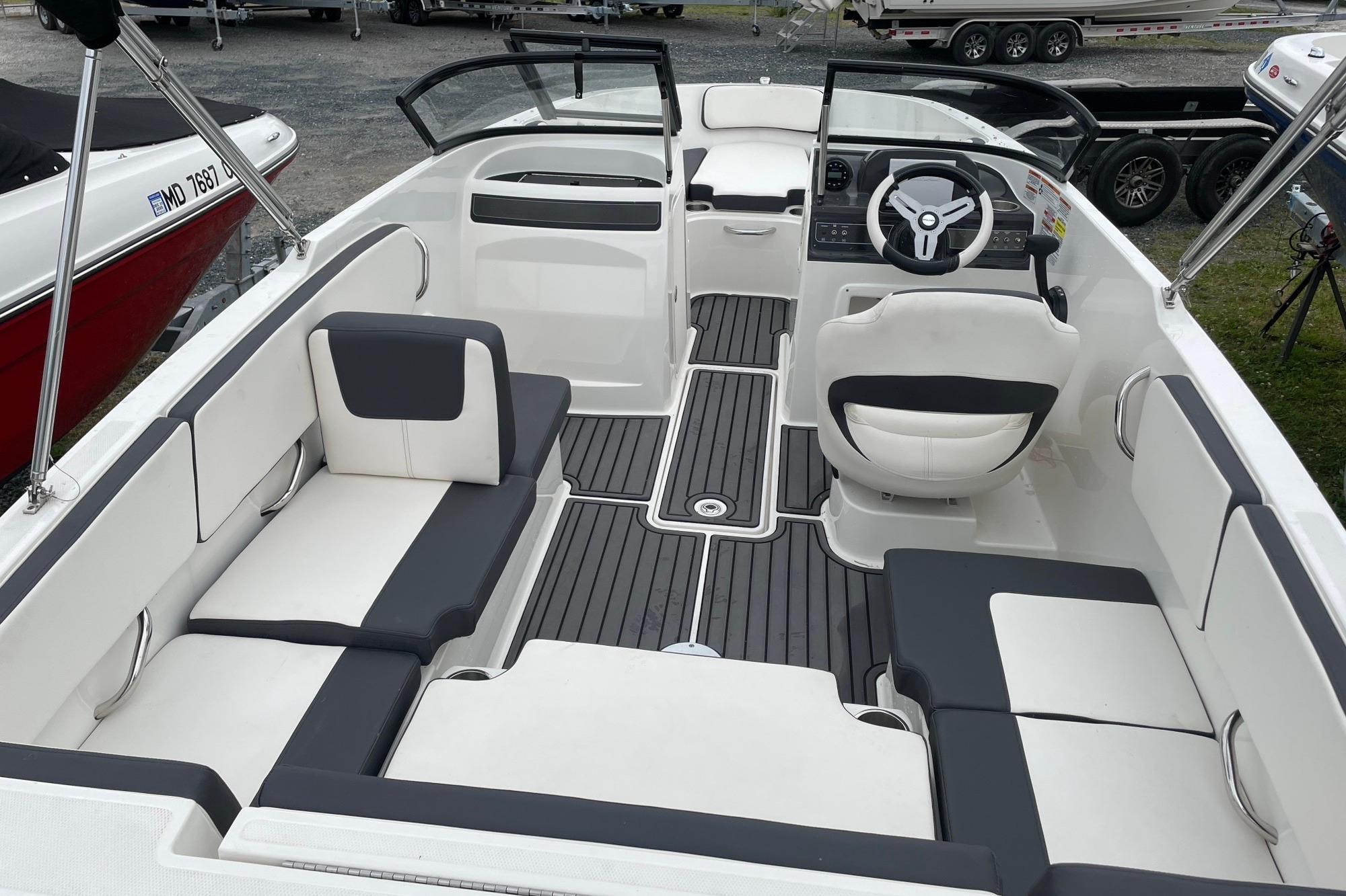 2023 Bayliner VR4 Bowrider OB interior with sleek seating and modern steering console.