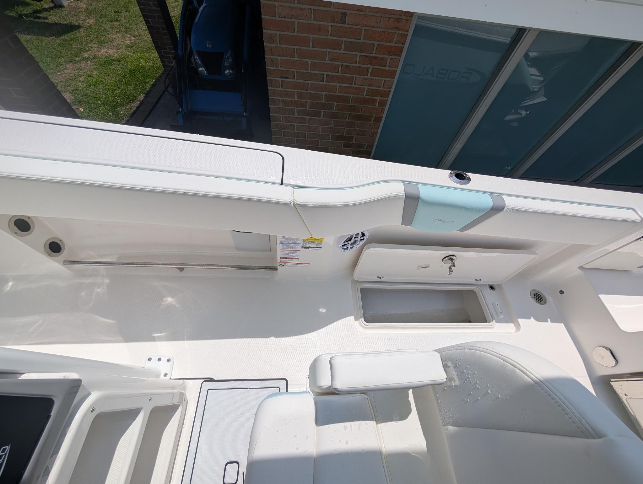 2025 Robalo R250 Center Console boat interior with storage compartments and seating.