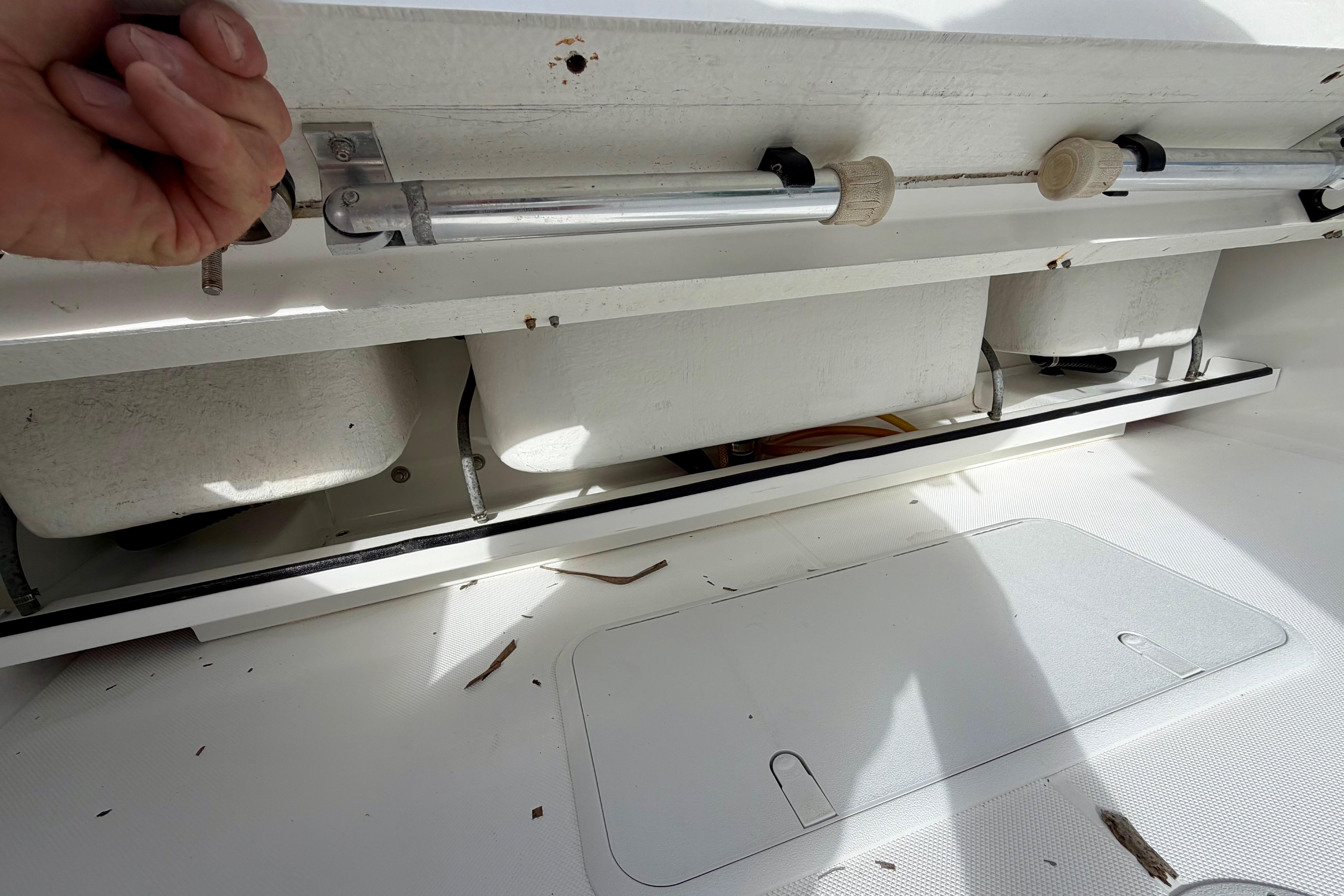 Interior view of 2025 Ocean Master 296 Center Console boat storage compartment.