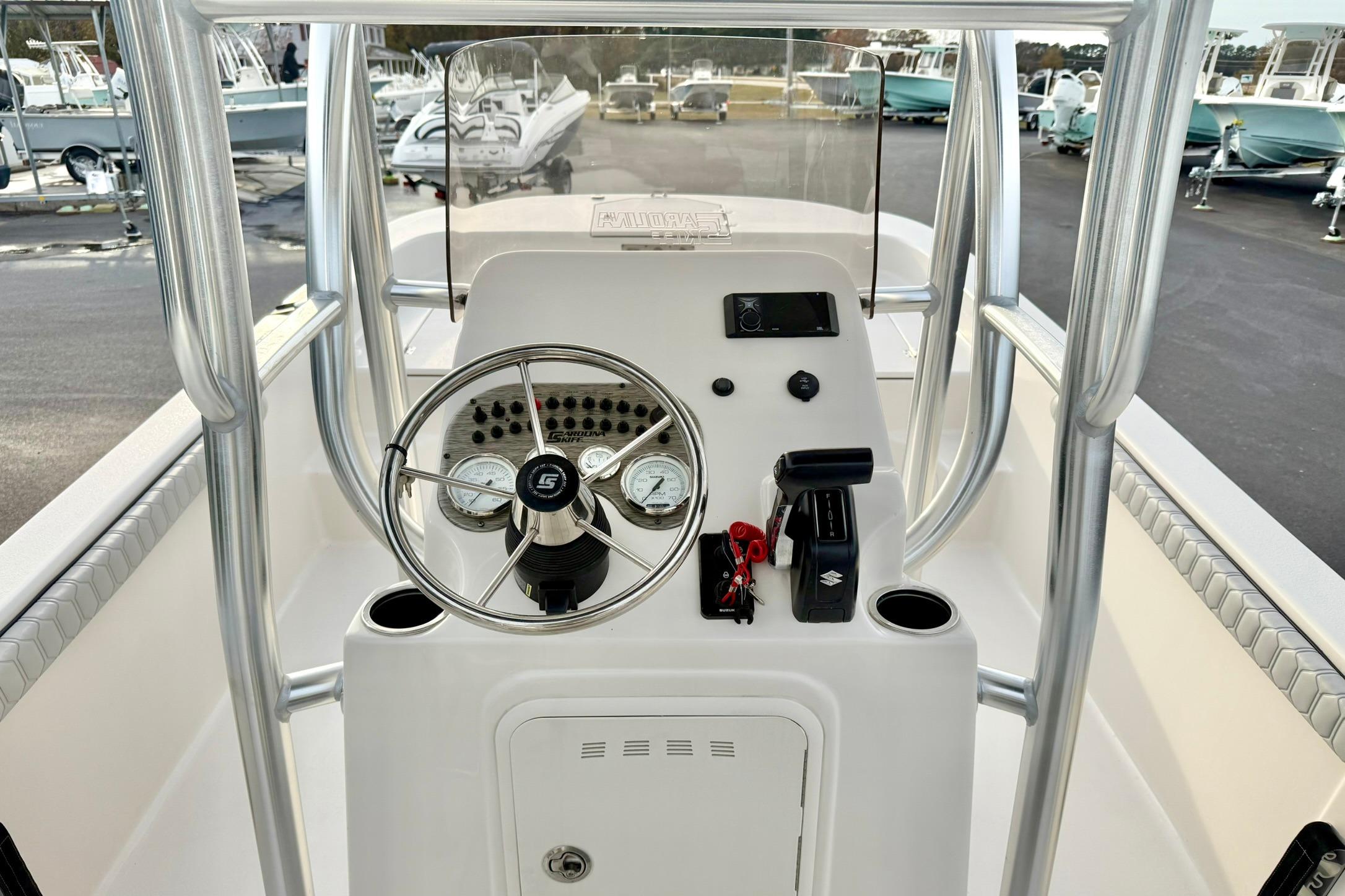 2025 Carolina Skiff 21 LS boat console with steering wheel and controls.