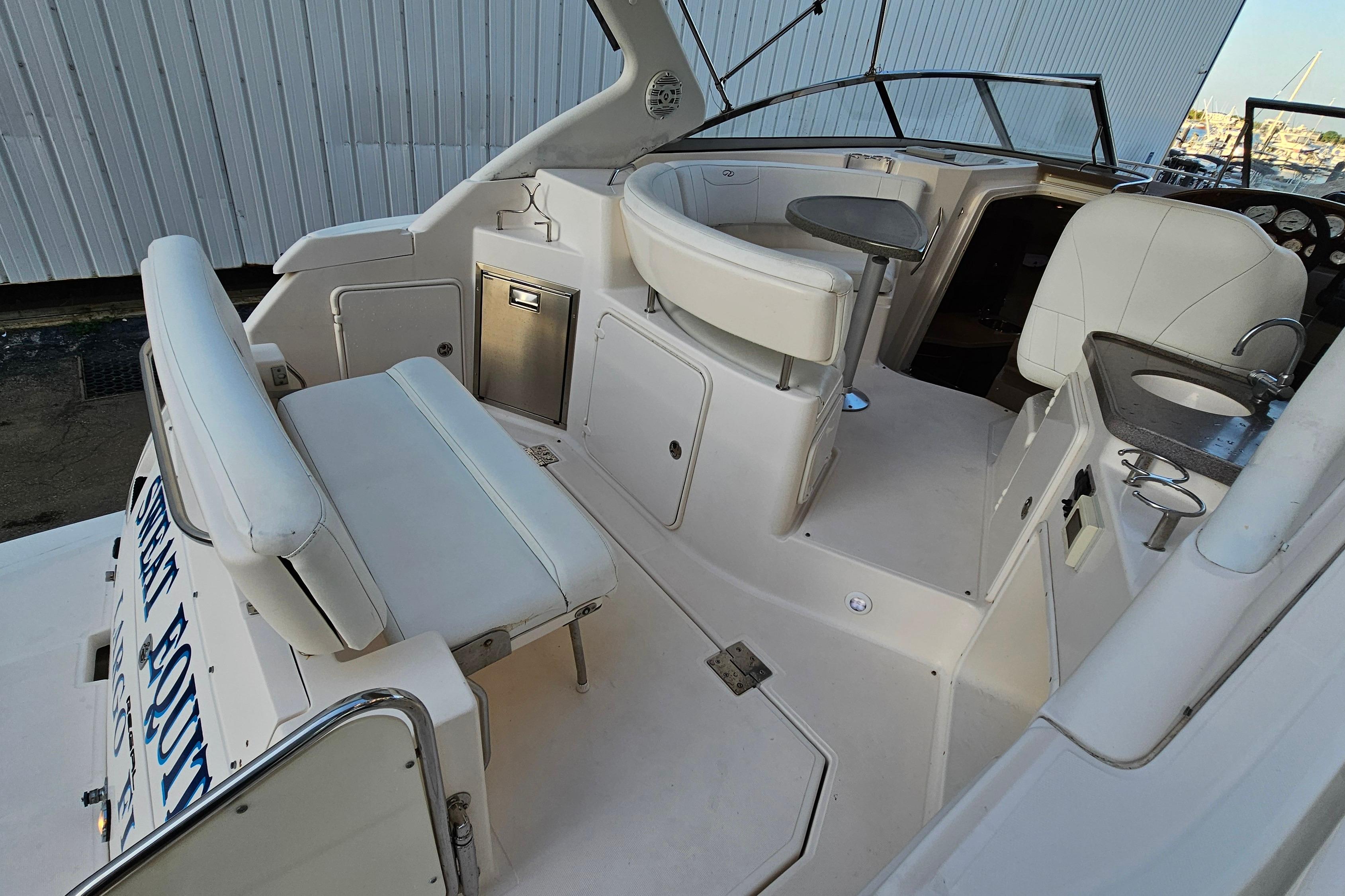 2005 Regal 3060 Window Express boat interior with seating and helm area.