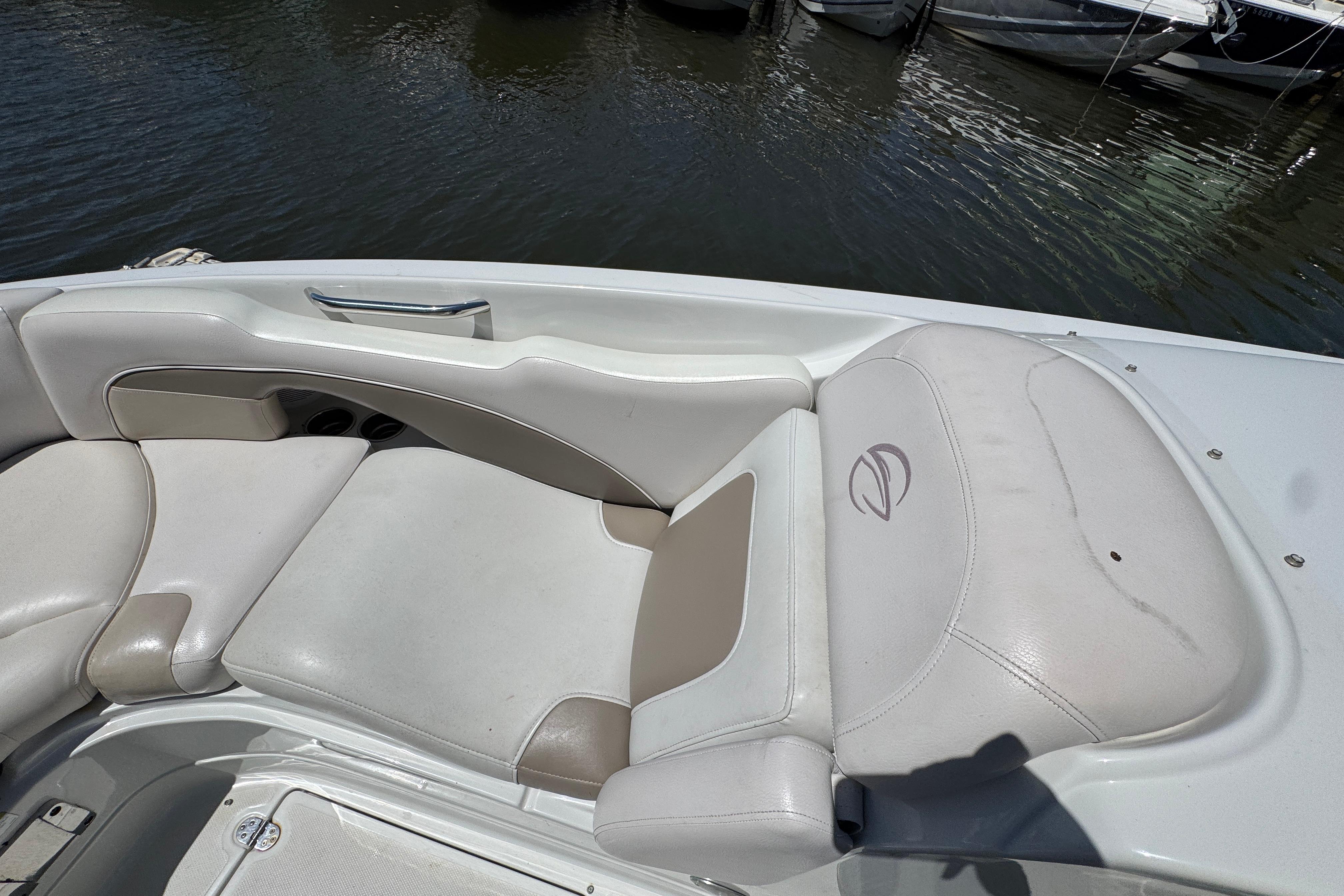 2013 Crownline Eclipse E6 XS boat interior with white and beige seating.