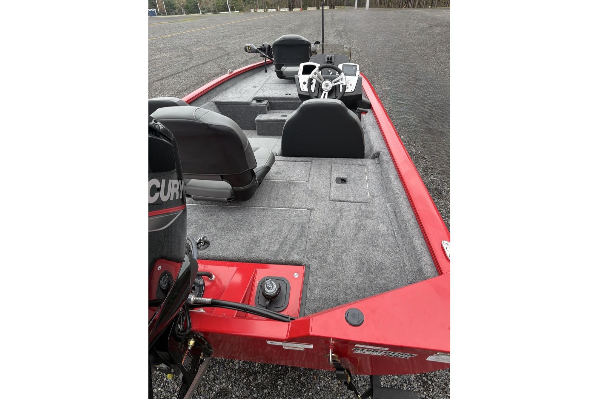 2026 Tracker Pro Team 175 boat with red exterior and spacious interior layout.