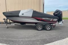 2023 Nitro ZV19 Sport boat on trailer, covered and parked outdoors.