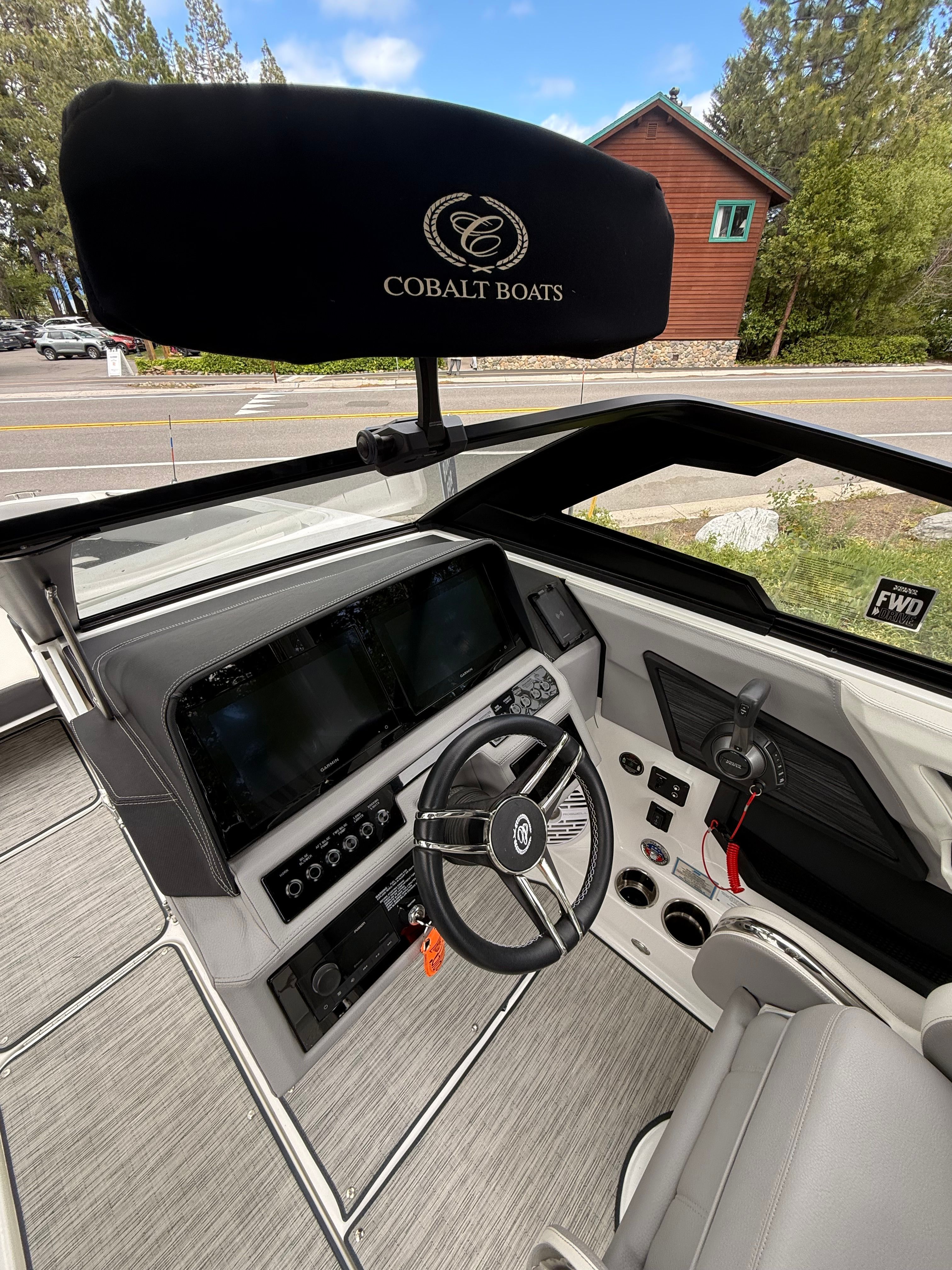 Interior view of a 2022 Cobalt R8 Surf boat with a modern helm.