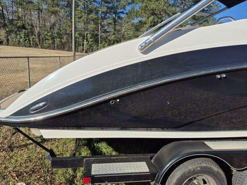 2011 Yamaha Boats 242 Limited S on trailer, side view, outdoors.