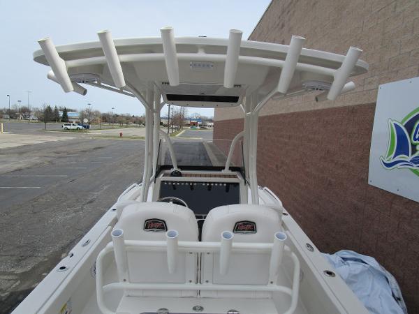 2024 Ranger 2360 Bay boat with T-top and rod holders.