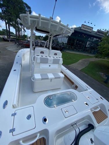 2024 Ranger 2600 Bay boat with spacious deck and seating, parked outdoors.