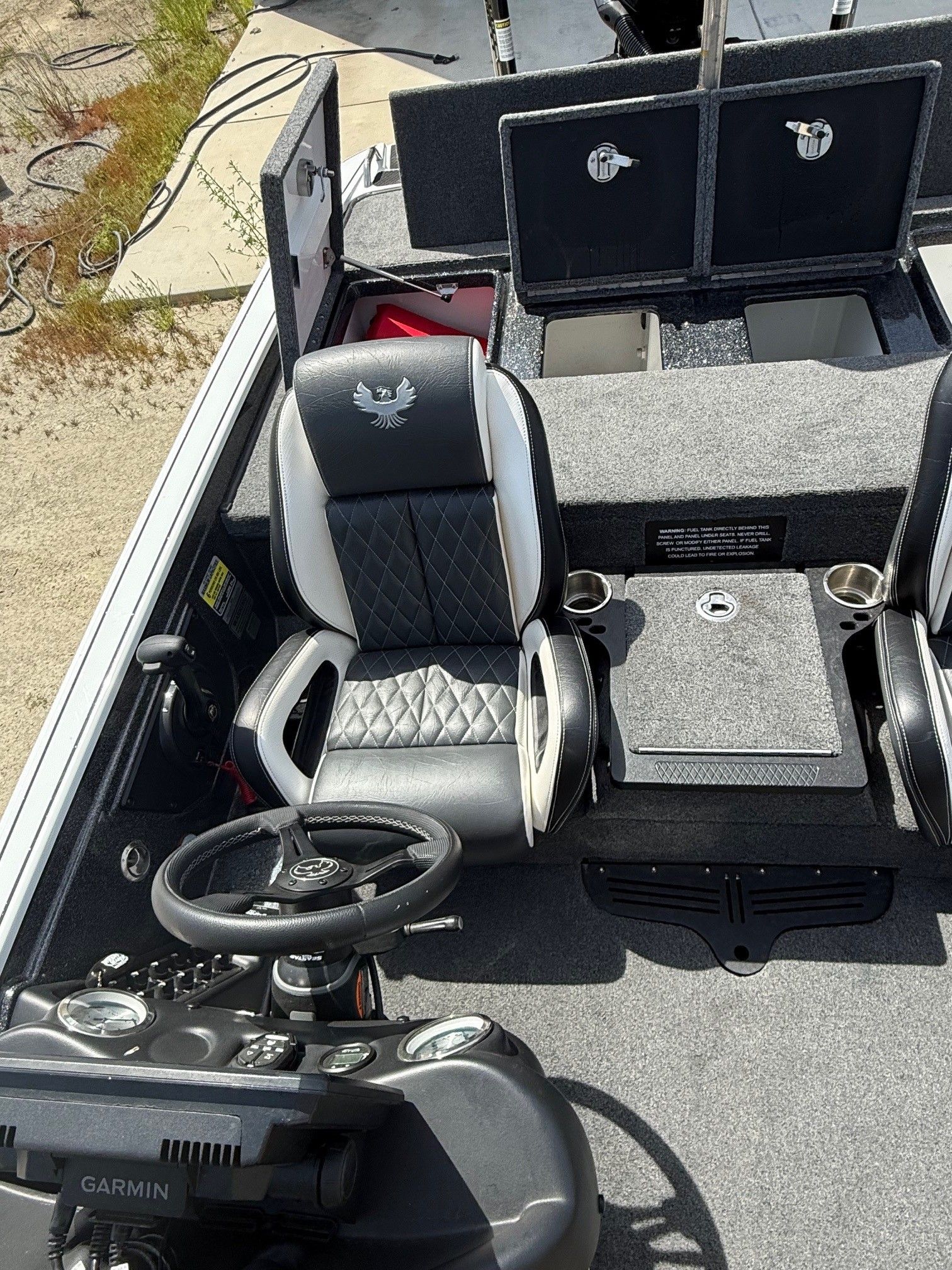 Interior of 2025 Phoenix 721 ZXL boat with steering wheel and seats.