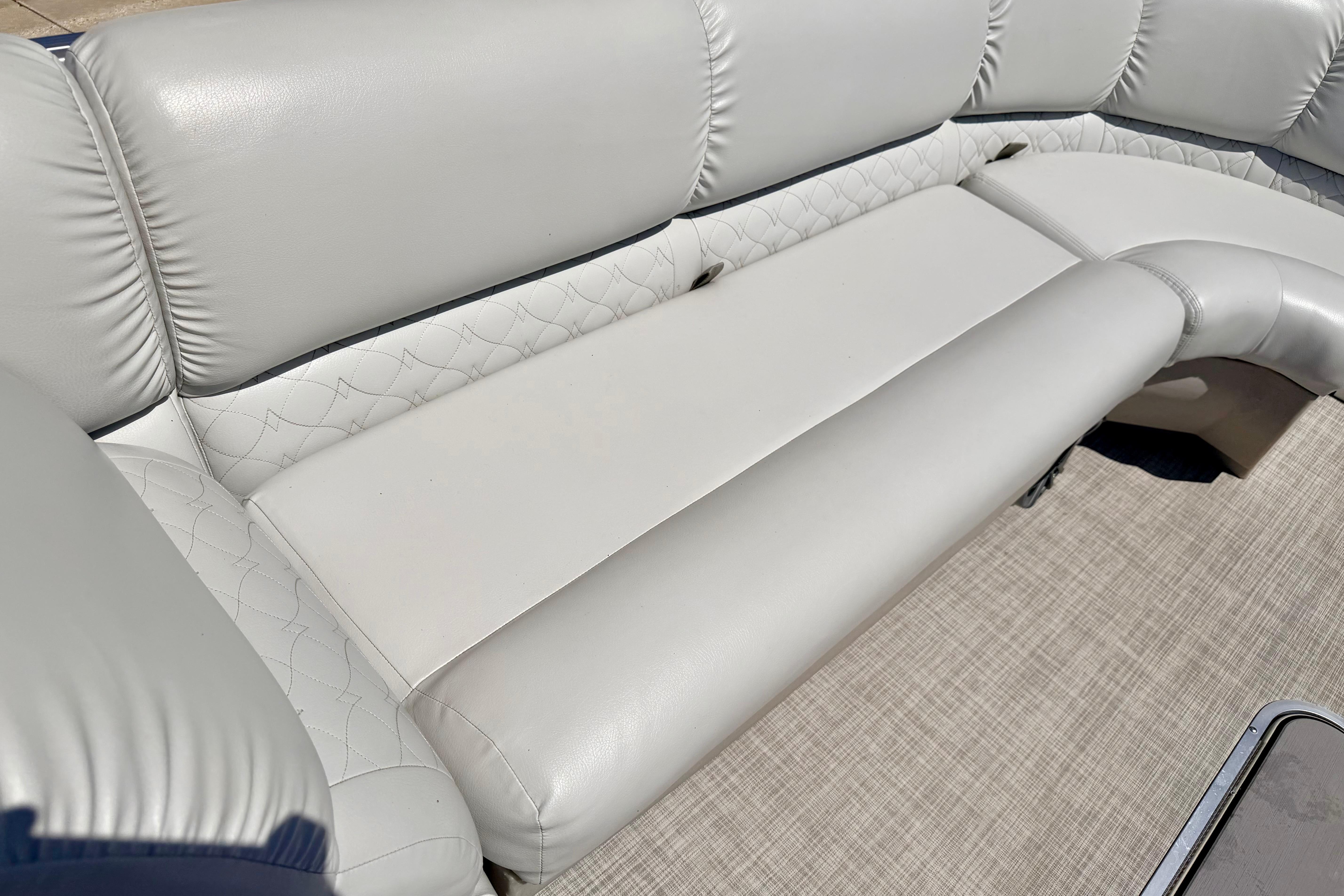 Luxurious seating on 2019 Crestliner 240 Rally DX CW boat, featuring plush white upholstery.