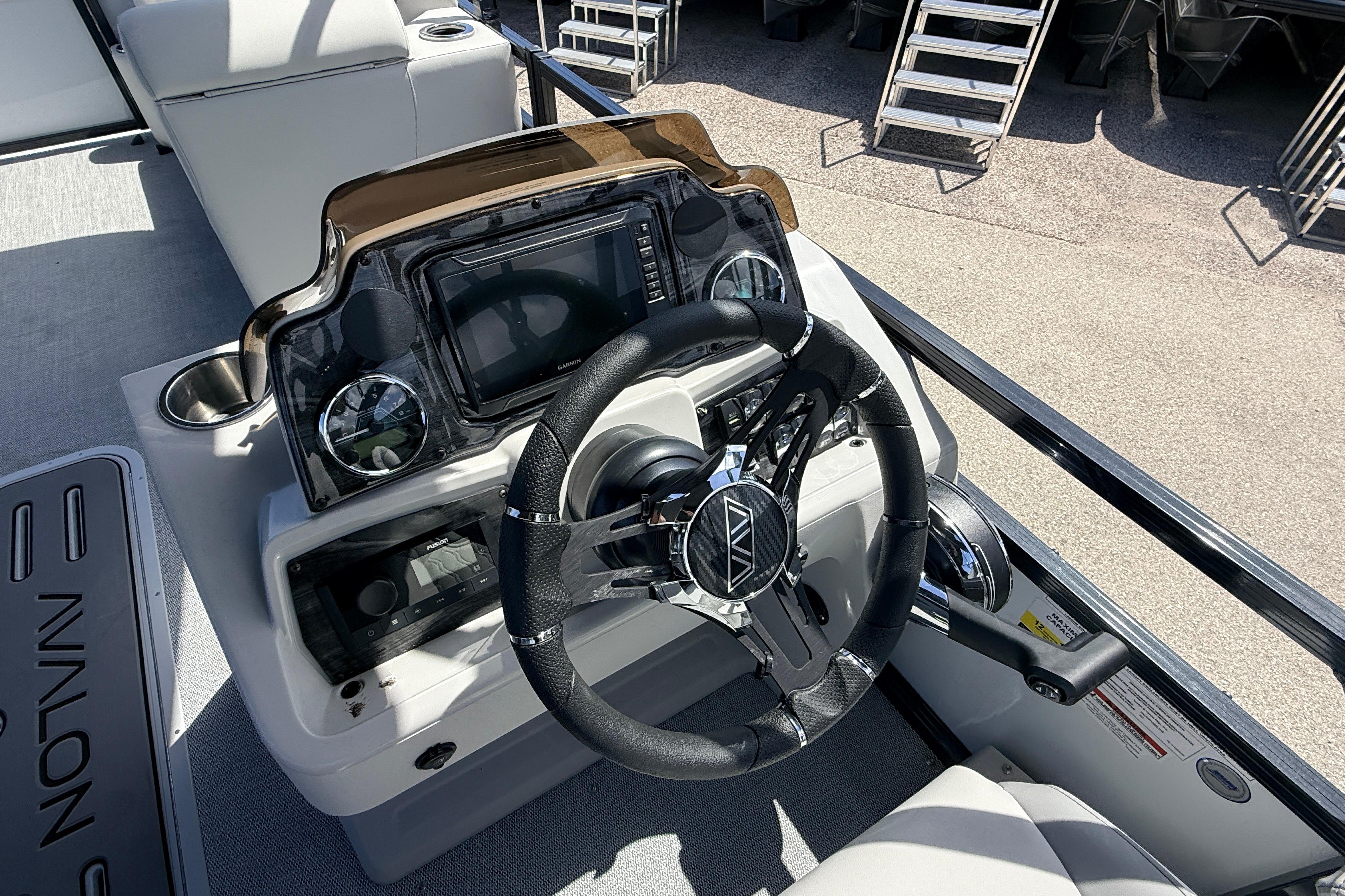 Steering console of 2026 Avalon 2385 Venture 85 Rear Fish Tri Toon boat.