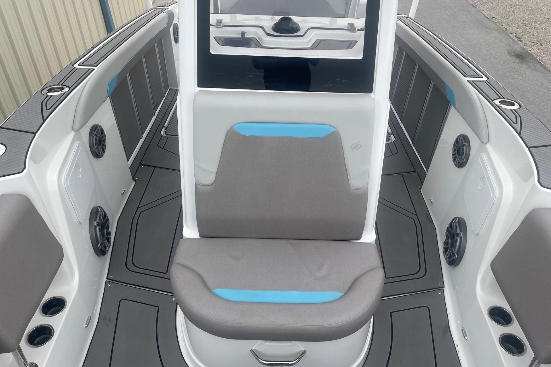 2025 Hurricane Center Console 24 OB boat interior with seating and speakers.