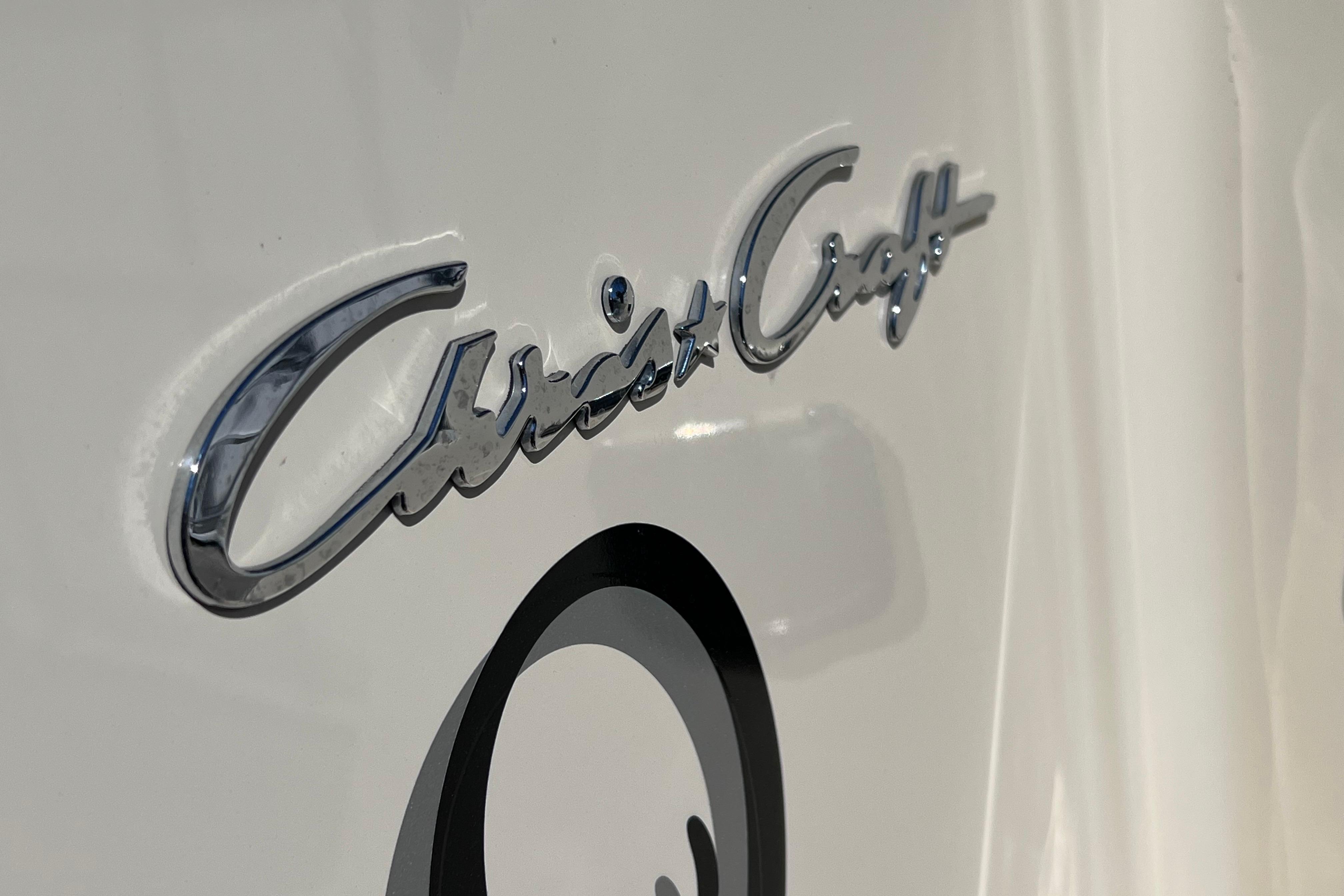 Chrome Chris-Craft logo on 2022 Catalina 30 boat hull.