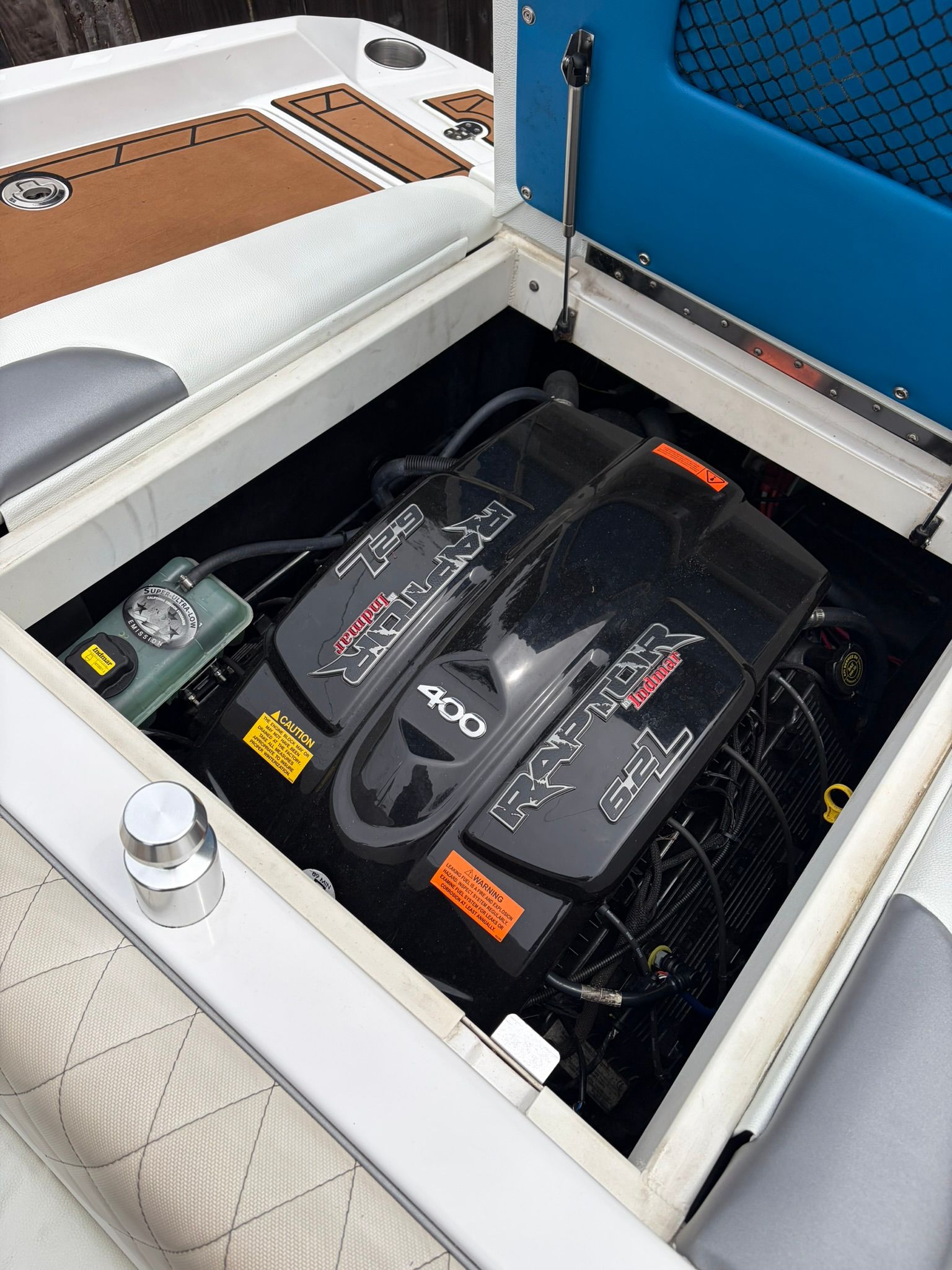 The engine compartment of a 2016 Tigé RZ2 boat with a Raptor 400 engine is visible.
