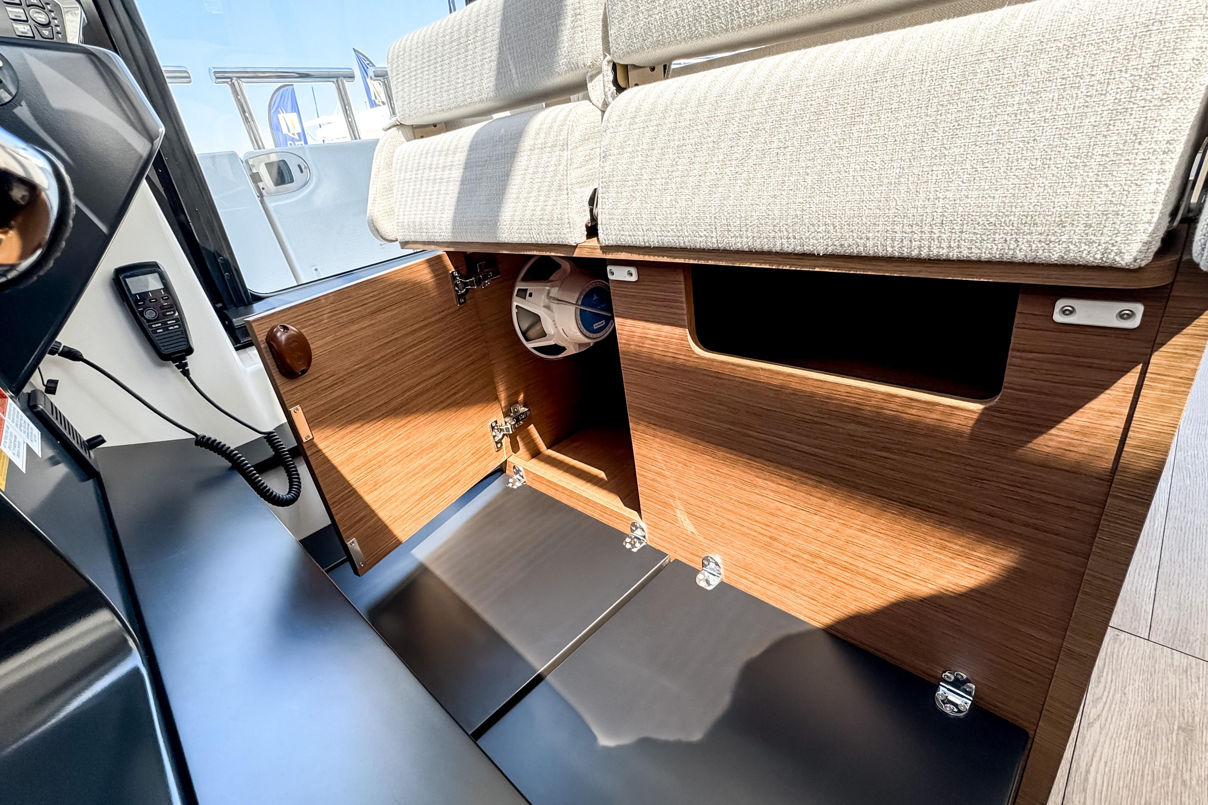 Interior of 2026 Wellcraft 44 Explorer with wood paneling and seating area.