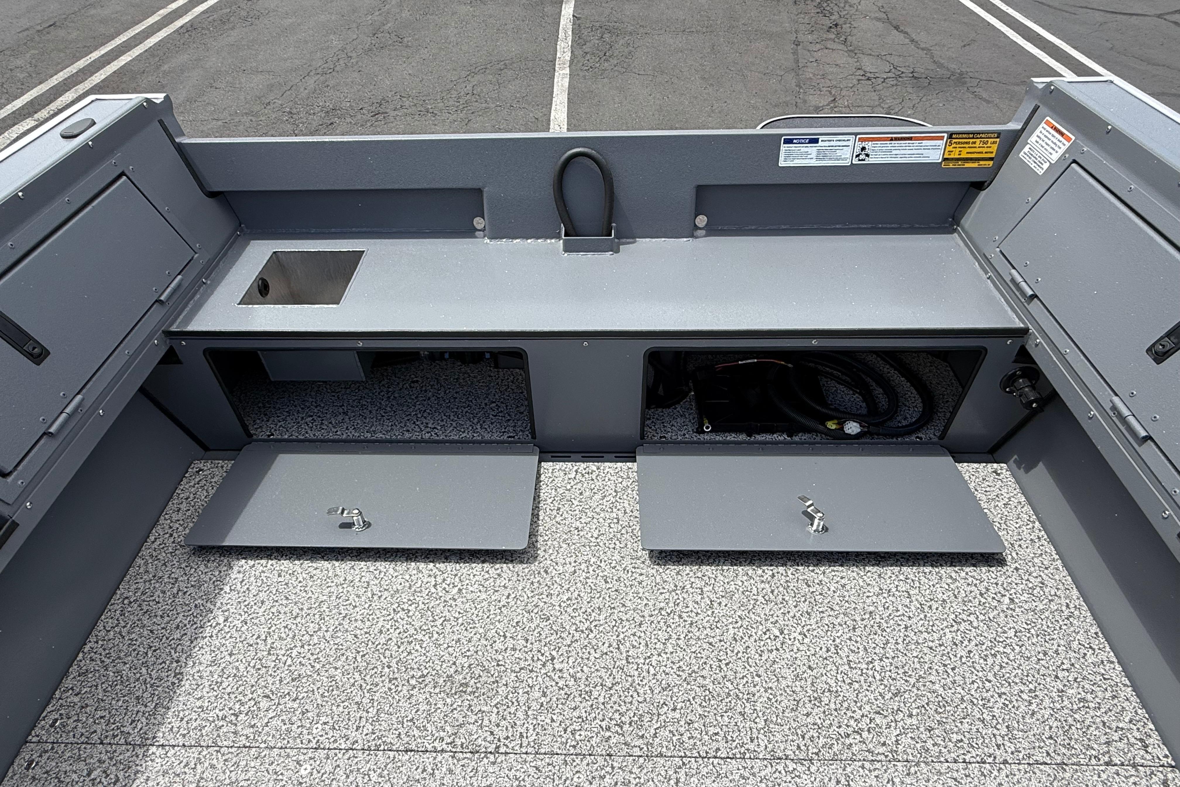 2026 Alumaweld Free Drifter 20 boat interior with storage compartments and sink.