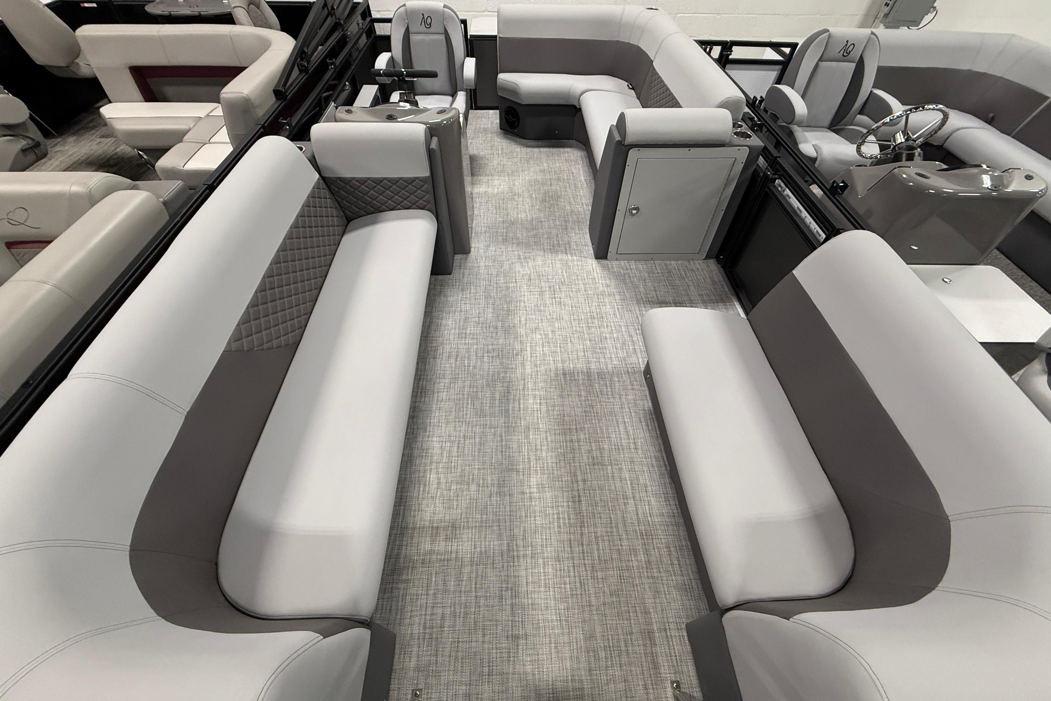 2026 Angler Quest 818 Panfish Cruise interior with gray seating and modern design.