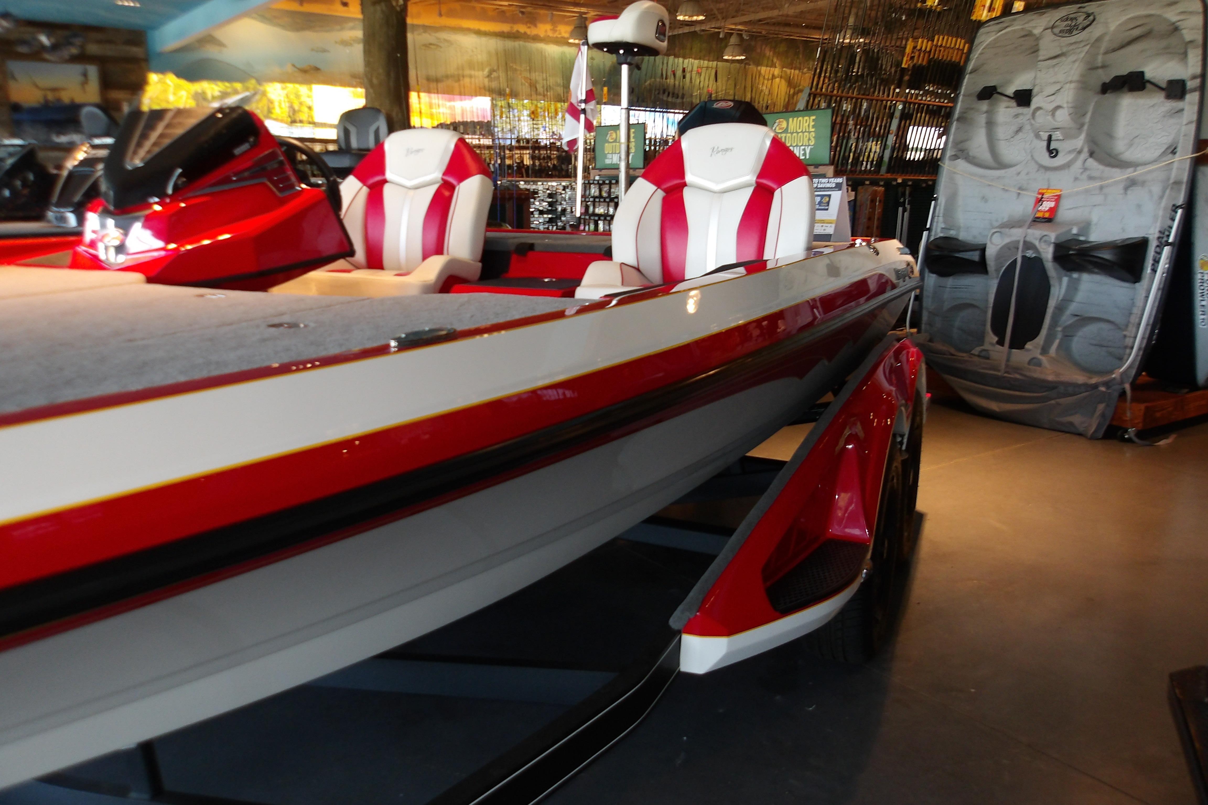 2025 Ranger Z519R Cup-Equipped boat with red and white seats in showroom display.