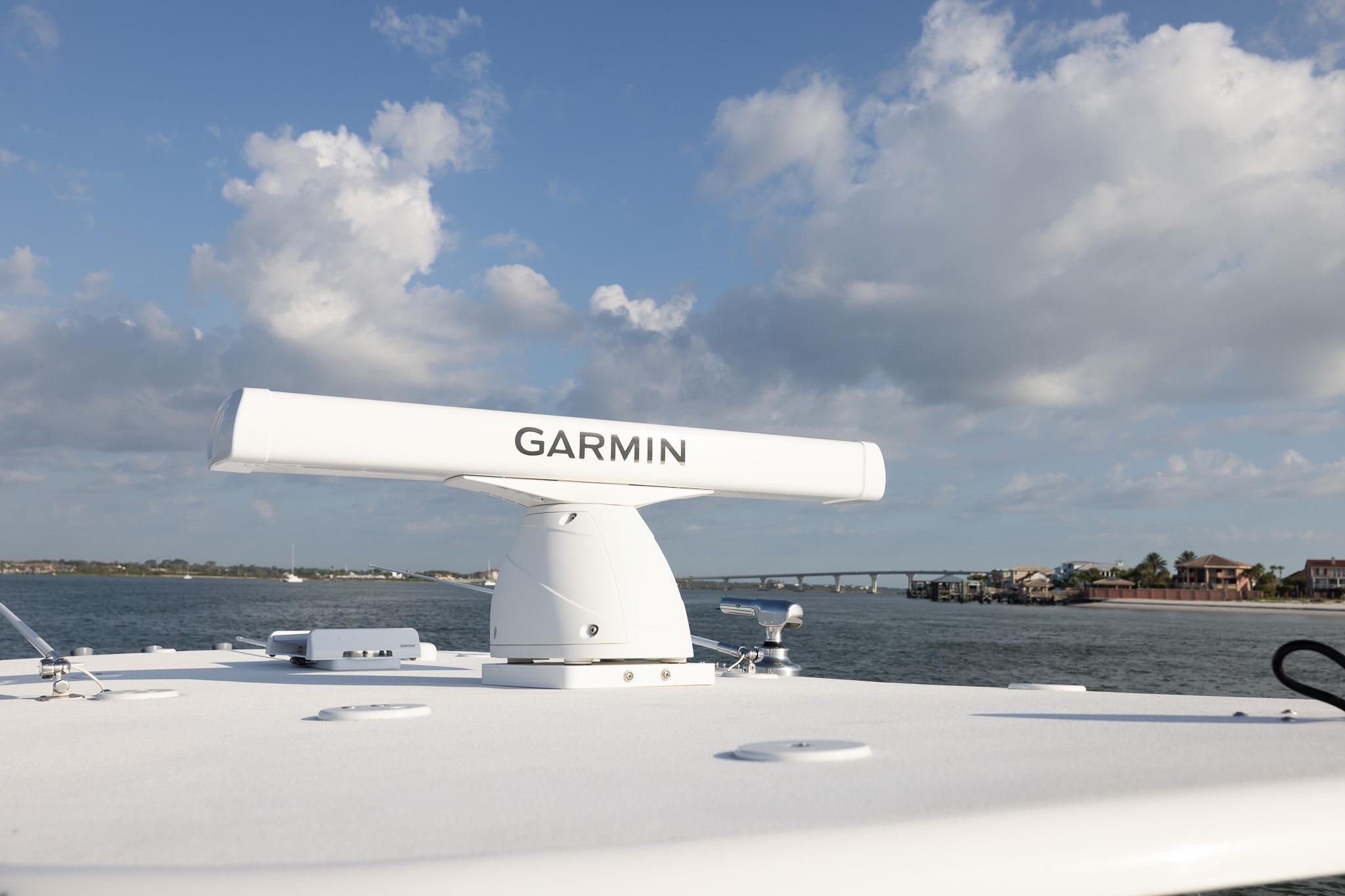 Garmin radar on 2026 Front Runner 37 Catamaran, coastal view with bridge and houses.