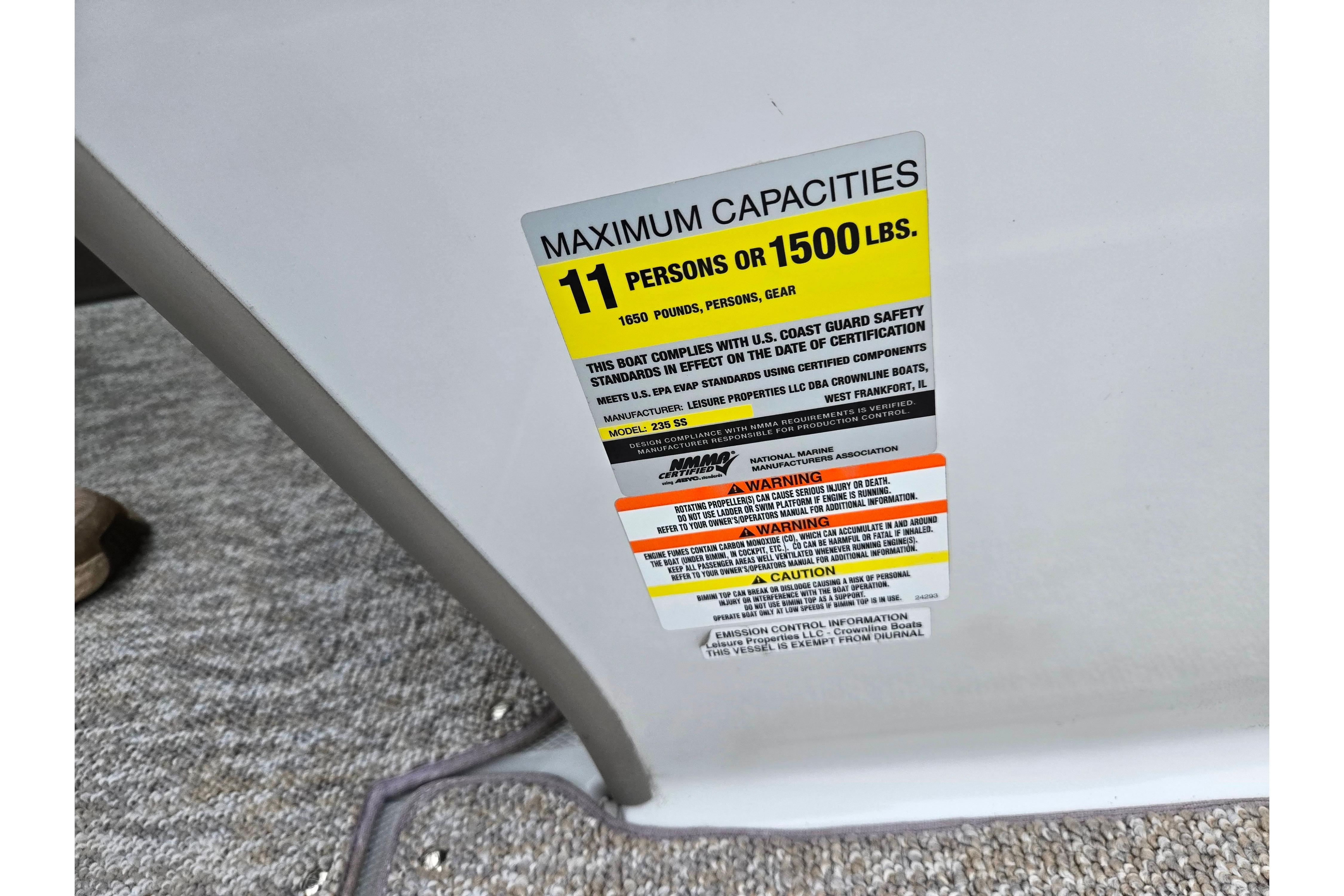 Capacity label on 2012 Crownline 235 SS boat, maximum 11 persons or 1500 lbs.