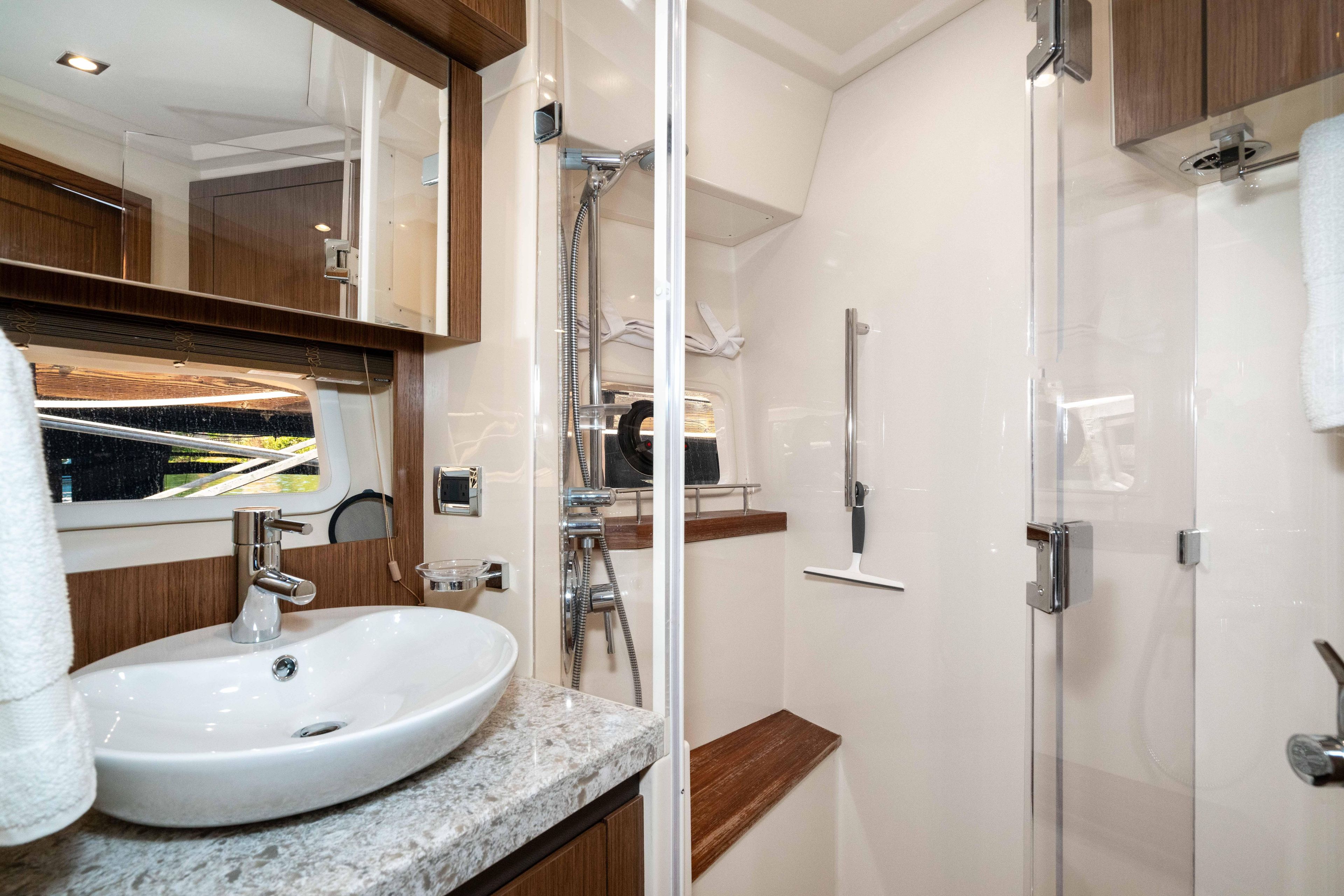 Luxurious bathroom interior of 2017 Sea Ray 510 Fly yacht with modern fixtures.
