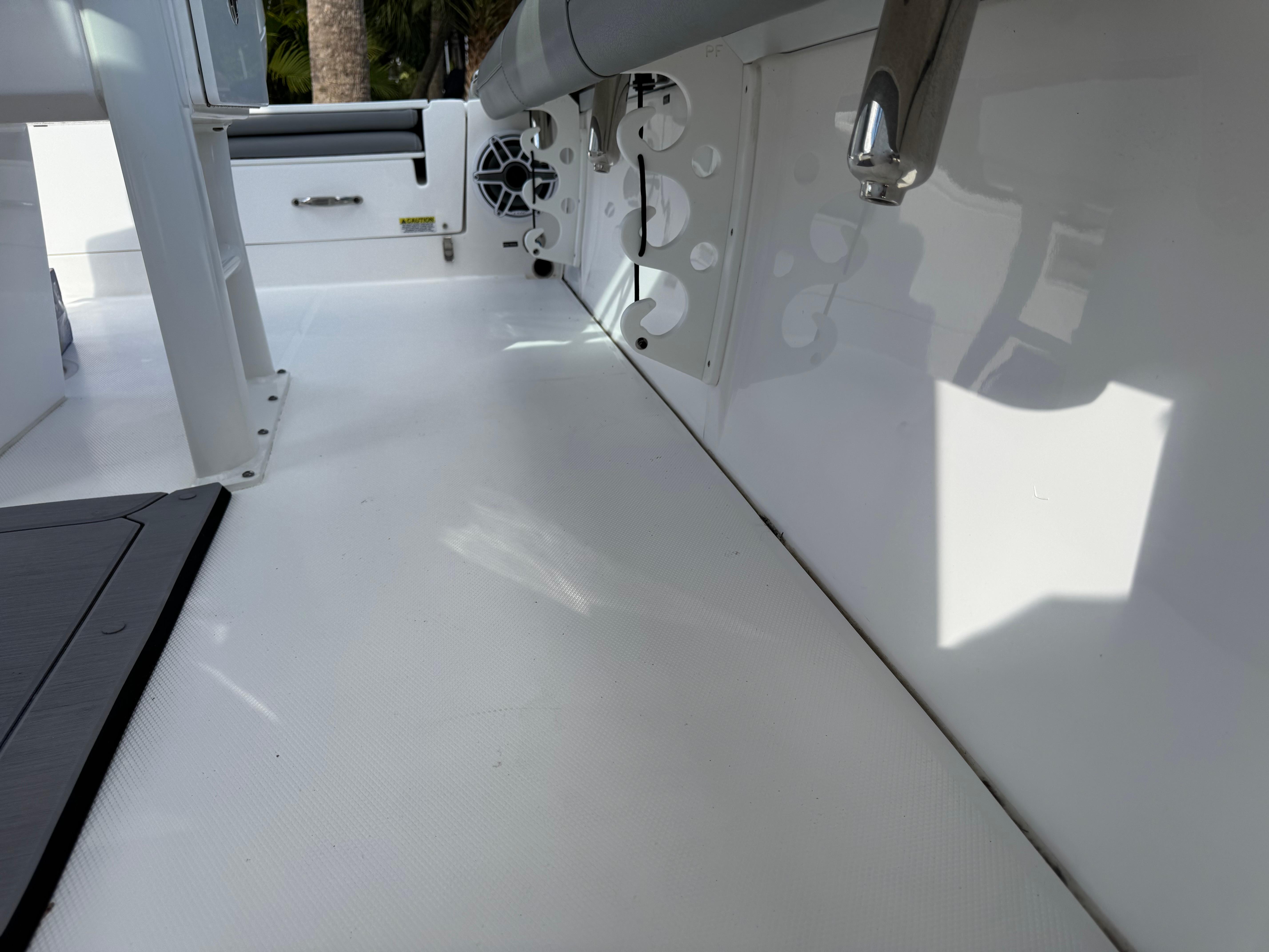 2024 Everglades 253 Center Console boat interior with white deck and seating.