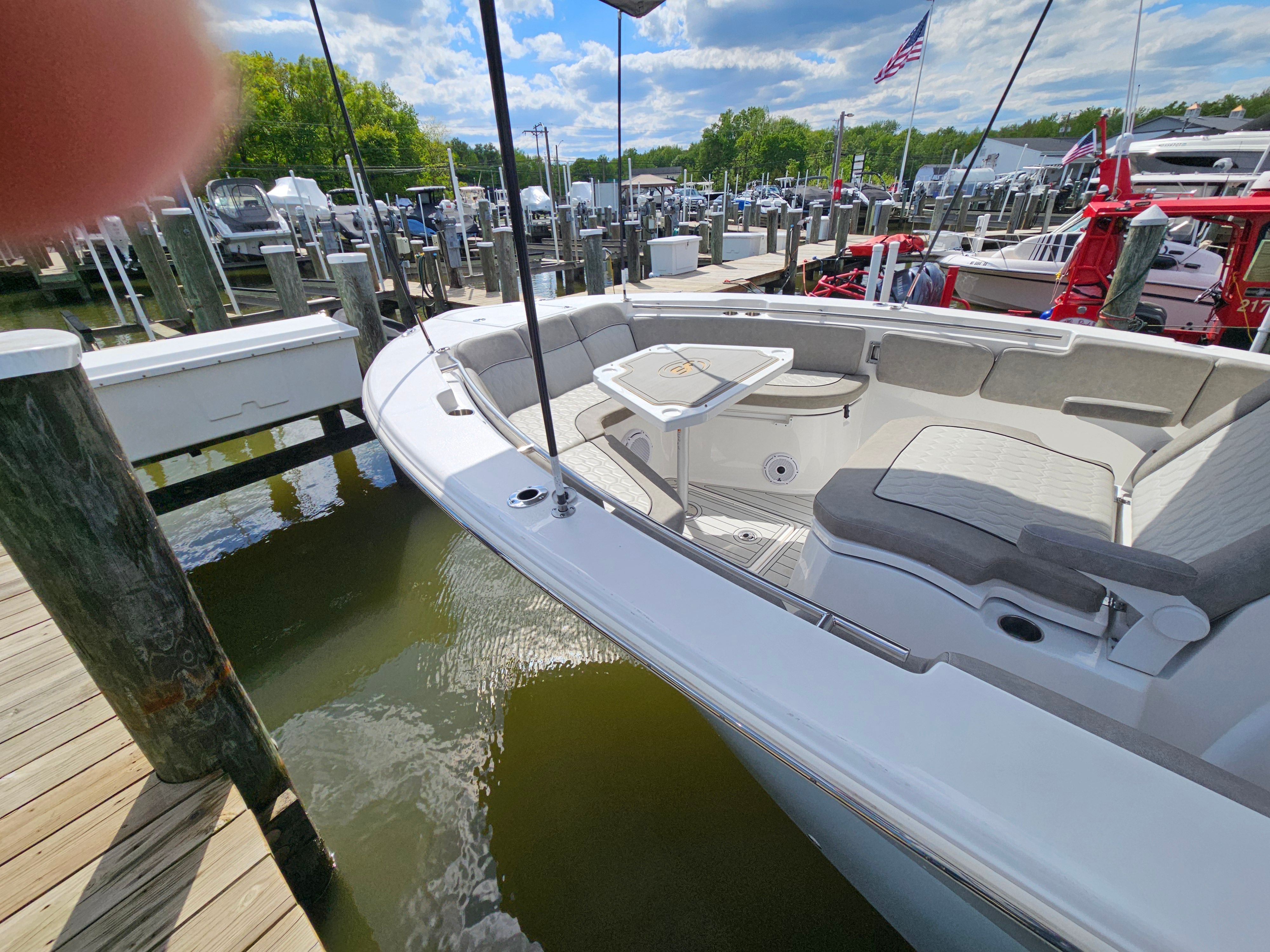 2021 Sea Fox 288 Commander at dock with seating area.