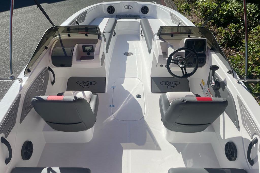 2026 Tahoe T21 boat interior with dual consoles, steering wheel, and seating.