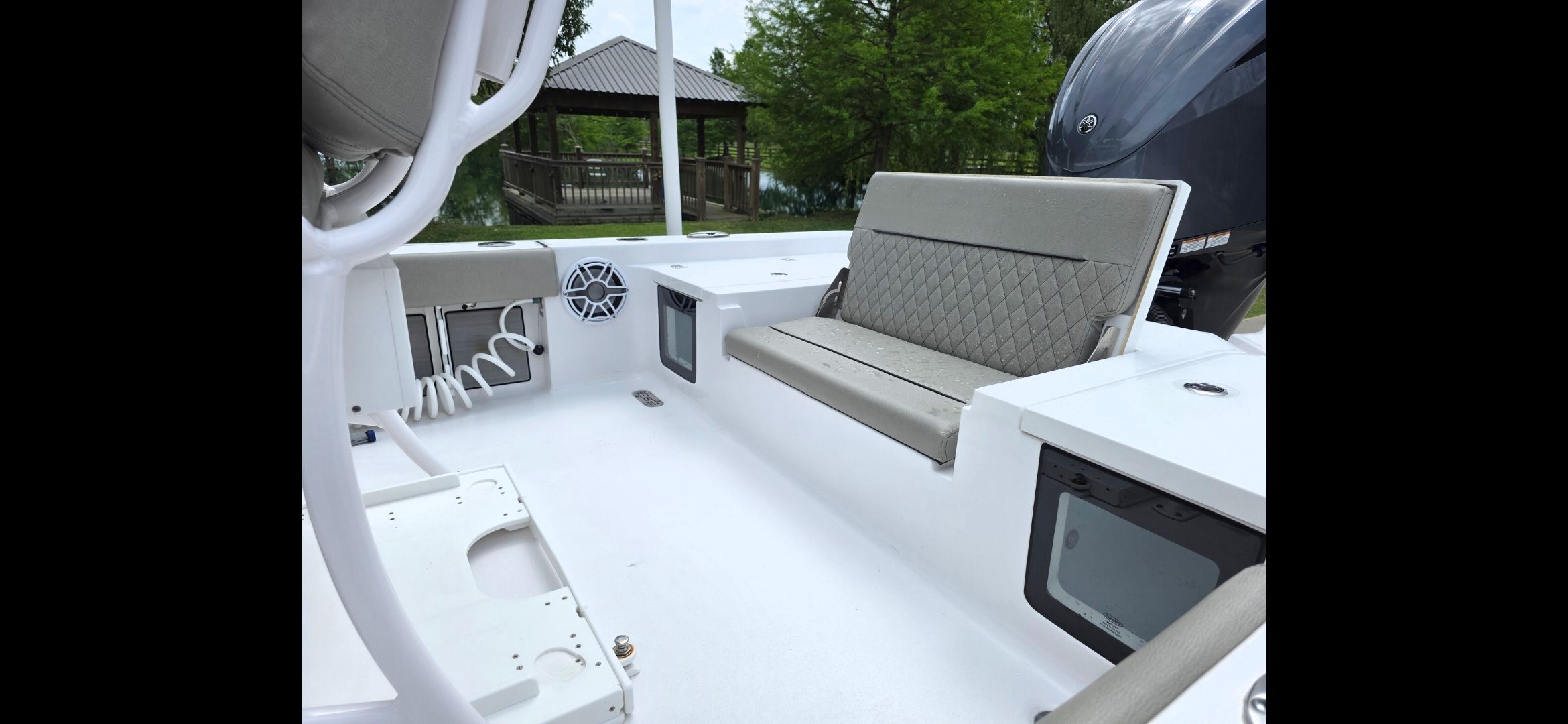 Interior of 2023 Sportsman Masters 247 Bay Boat with seating and motor.