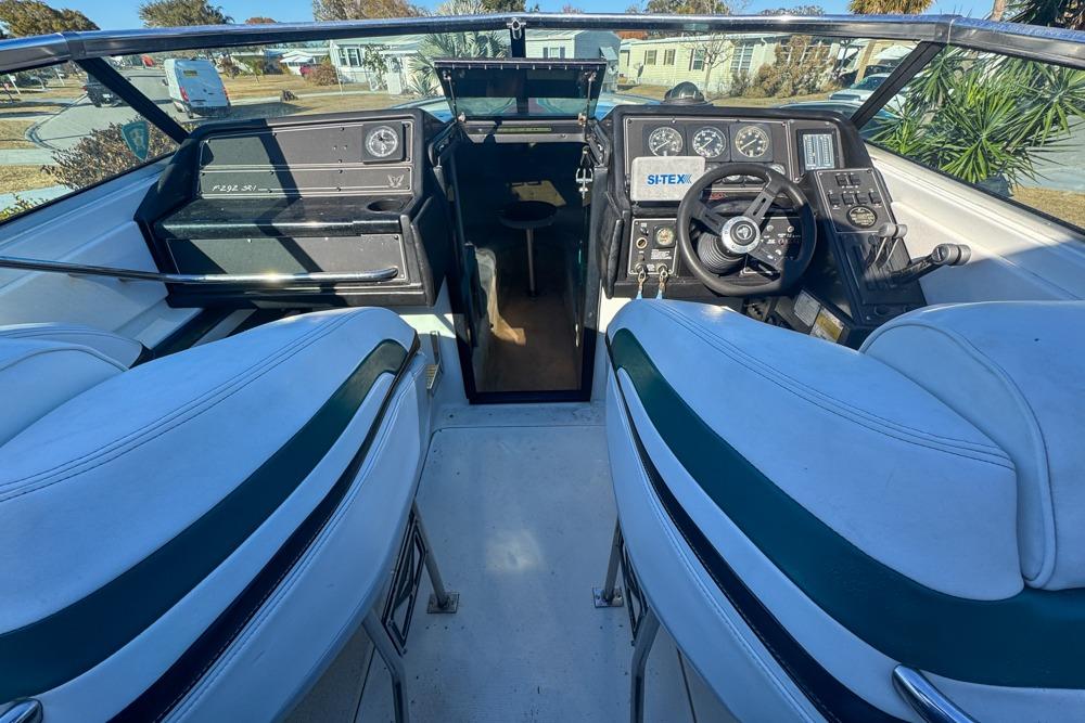 1989 Formula 292 SR-1 boat cockpit with steering wheel and dashboard controls.