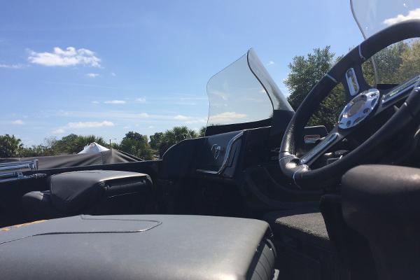 Interior of a 2020 Nitro ZV21 boat with steering wheel and windshield.