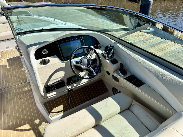 The cockpit of a 2018 Regal 3300 with modern steering and instruments.