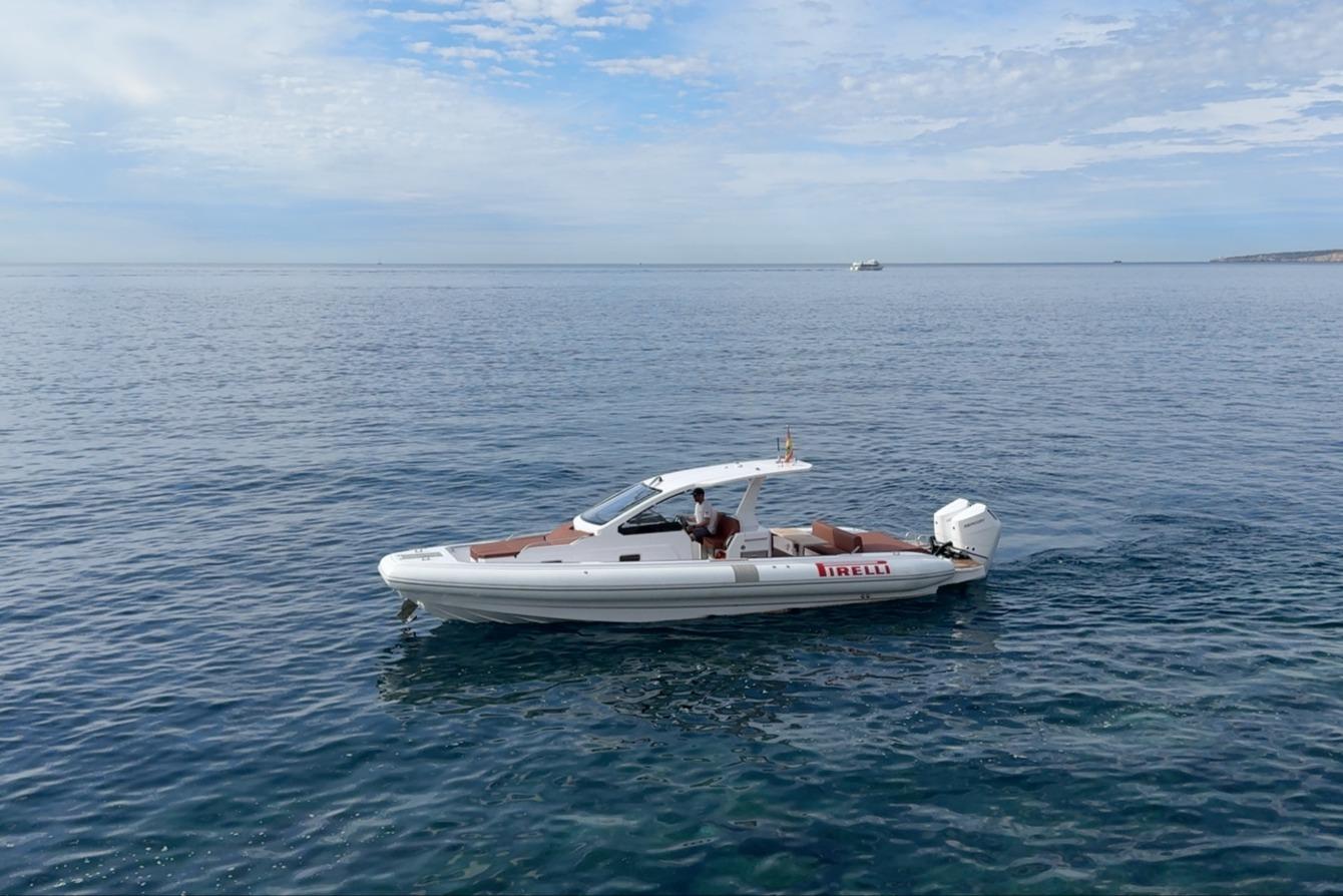 2024 Pirelli 35 boat on calm ocean waters under a partly cloudy sky.