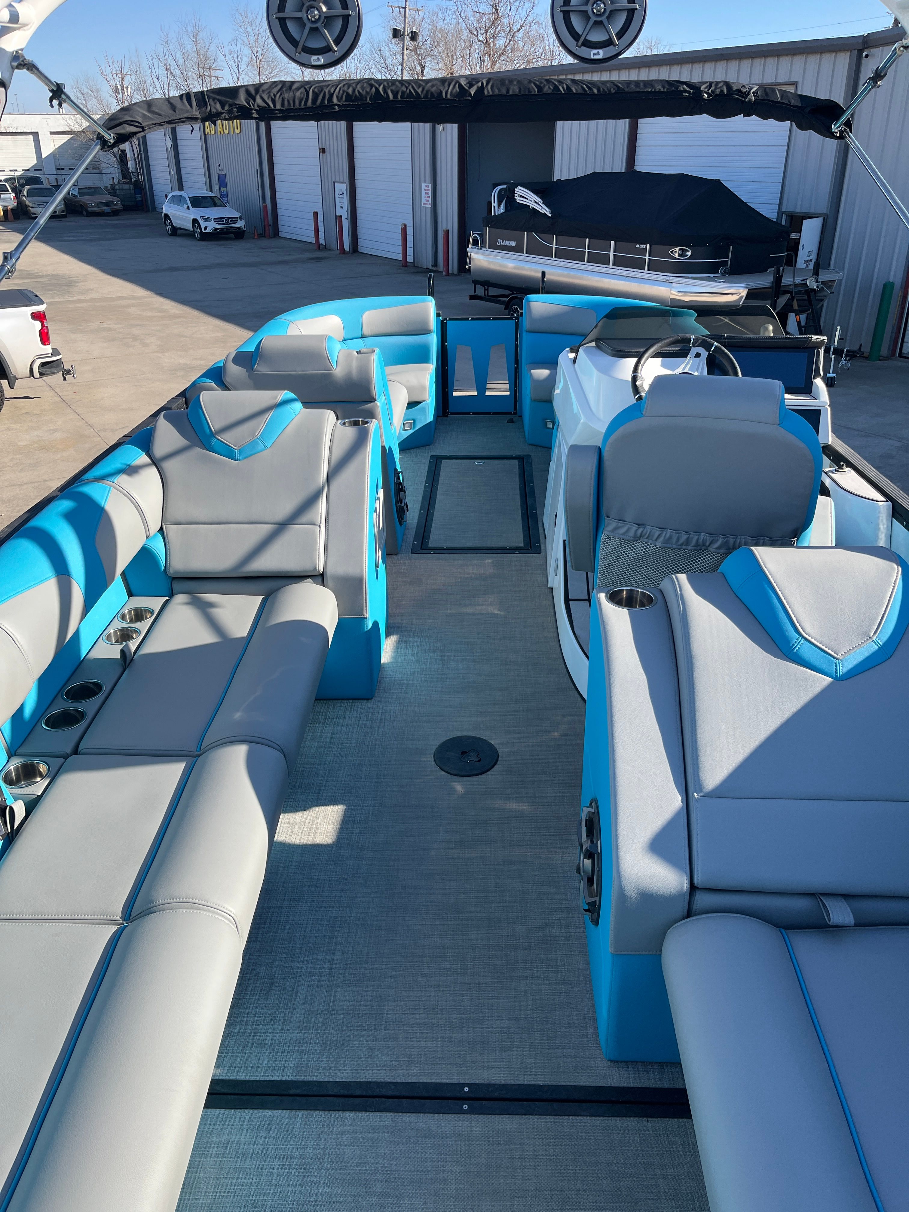 Interior of 2023 Montara Surf Boss 2.0 boat with blue and gray seating.