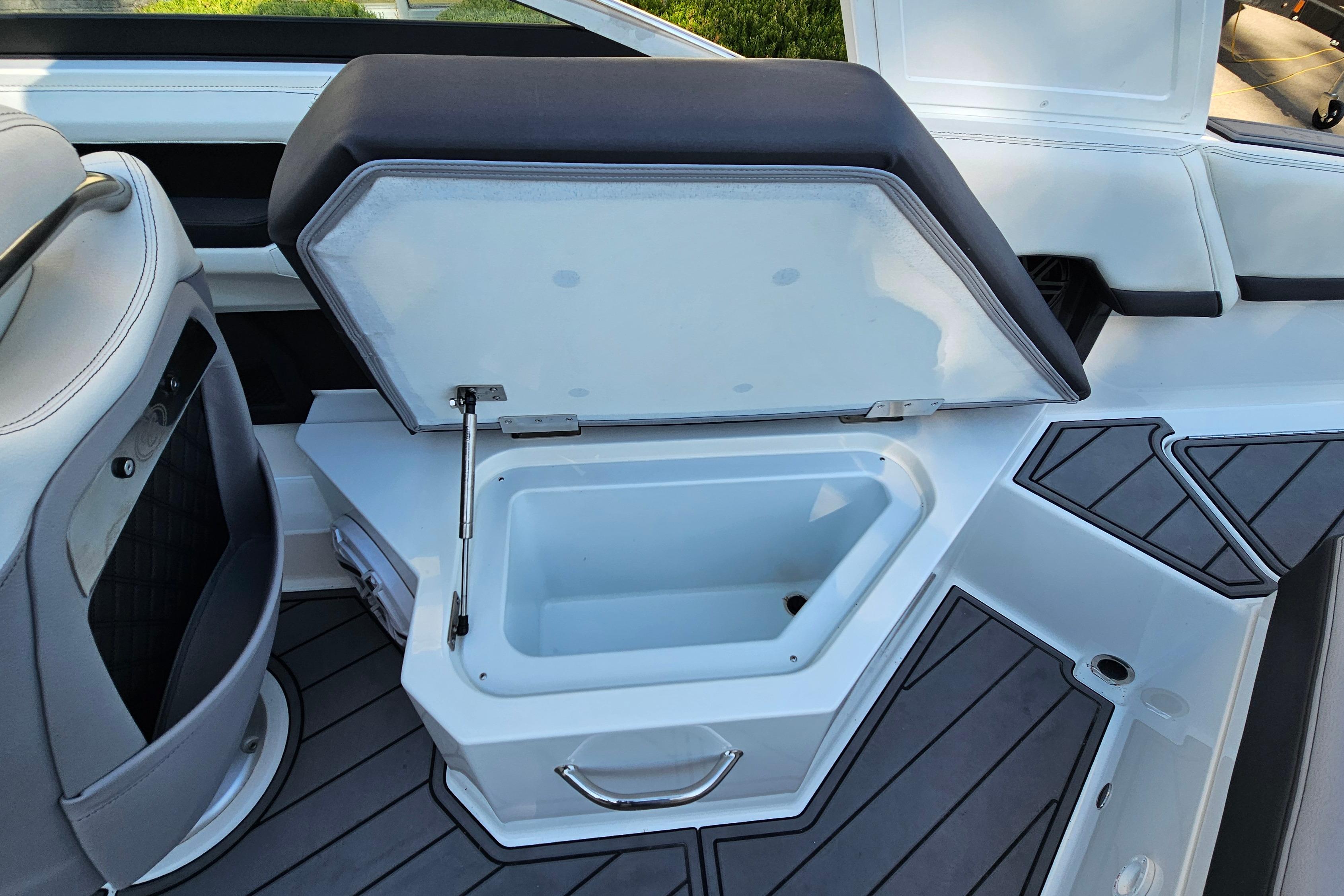2022 Cobalt R4 boat interior with open storage compartment and sleek seating design.