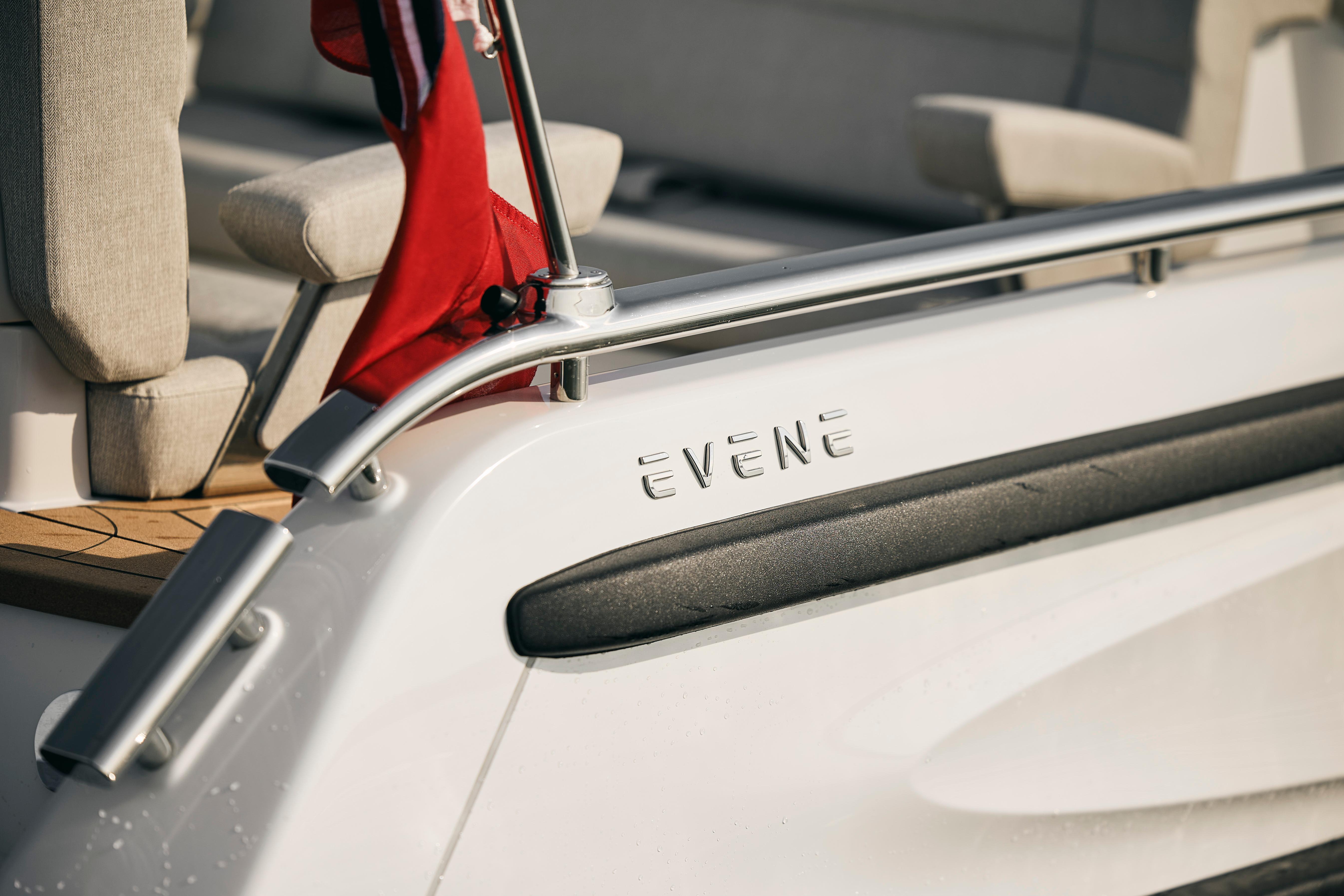 2026 Evene Origin 57 boat with sleek design and red flag detail.