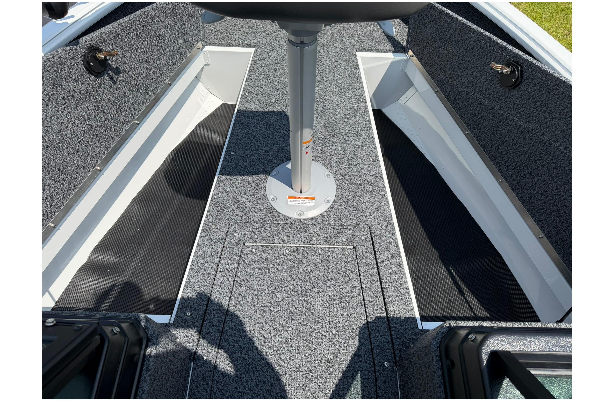 Interior view of 2027 Lund 1675 Adventure Sport boat, featuring storage compartments.