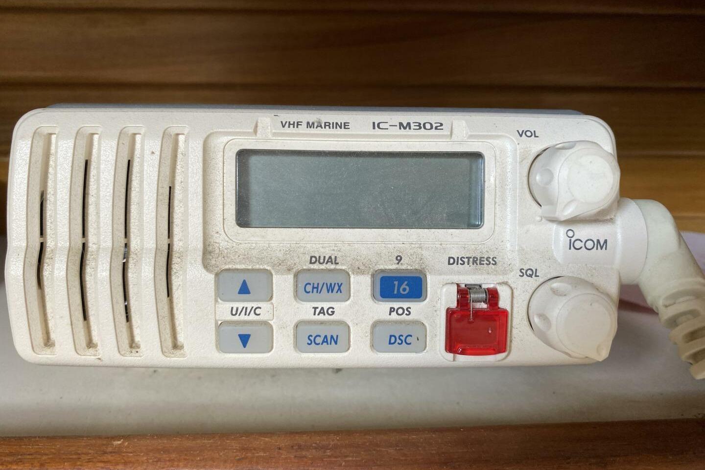 VHF marine radio IC-M302 on 1986 Catalina 34 sailboat, featuring distress and channel controls.