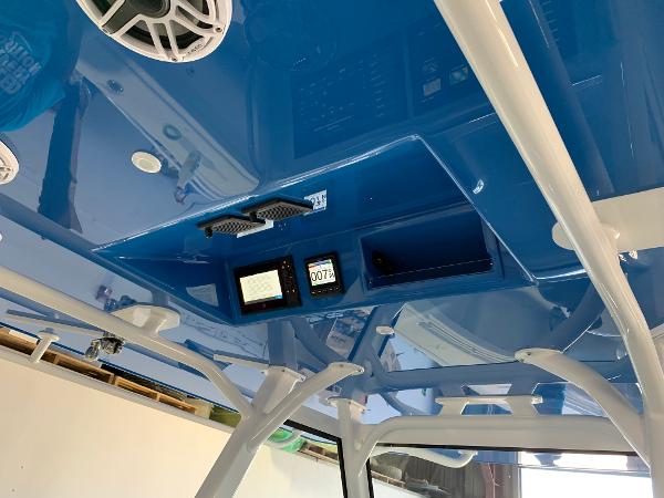 2022 Yellowfin 39 Offshore boat interior with blue ceiling and electronic displays.