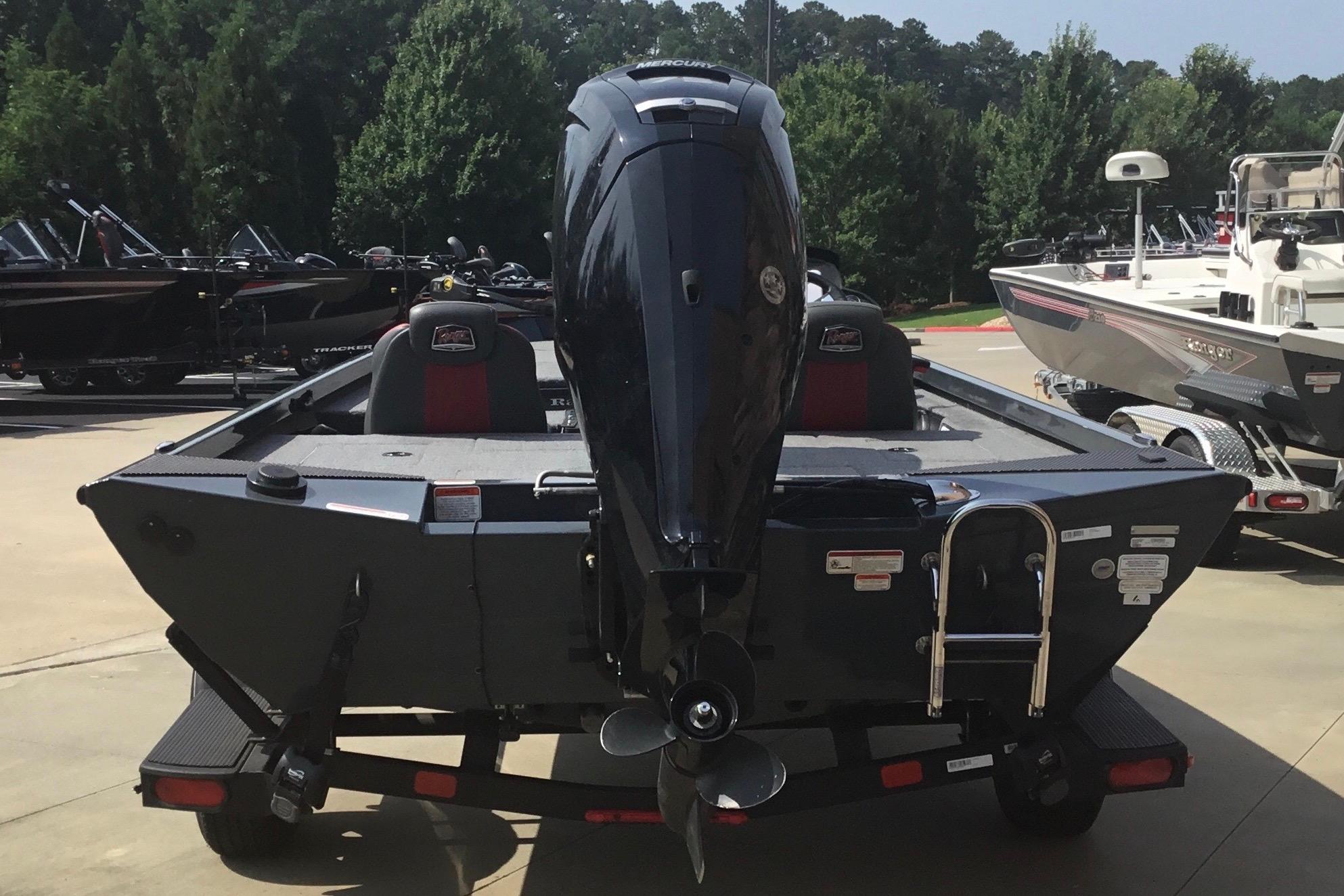2025 Ranger RT178 boat with outboard motor, parked on a trailer in a marina.