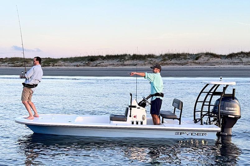Manufacturer Provided Image: Two people fishing on a 2025 Spyder FX17 Flicker boat in calm waters.