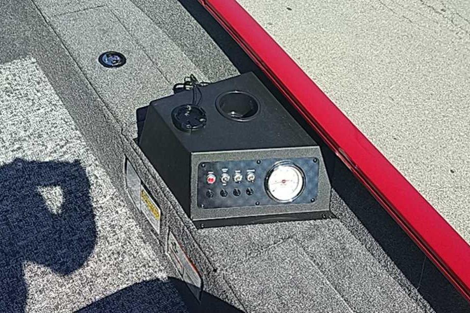 Control panel on 2026 Tracker Super Guide V-16 T boat, featuring switches and a gauge.