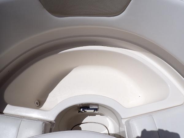 2011 Chaparral 287 SSX boat interior storage compartment, white and spacious design.