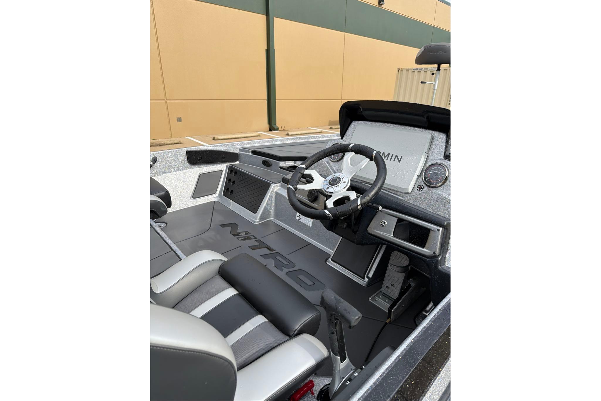 Interior of 2026 Nitro Z20 XL boat with steering wheel and dashboard.