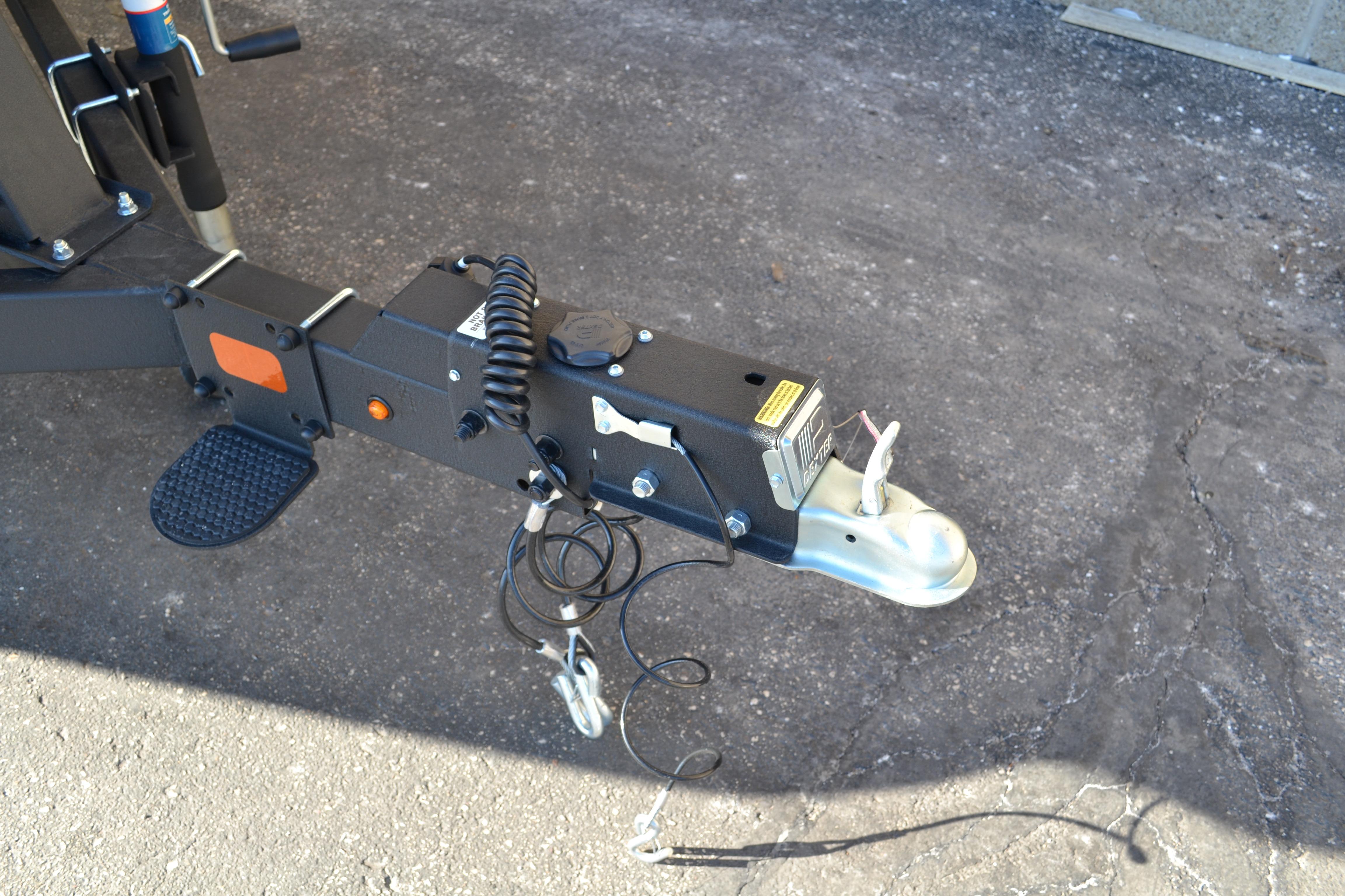 Trailer hitch of 2026 Sun Tracker SportFish 22 XP3 on concrete surface.