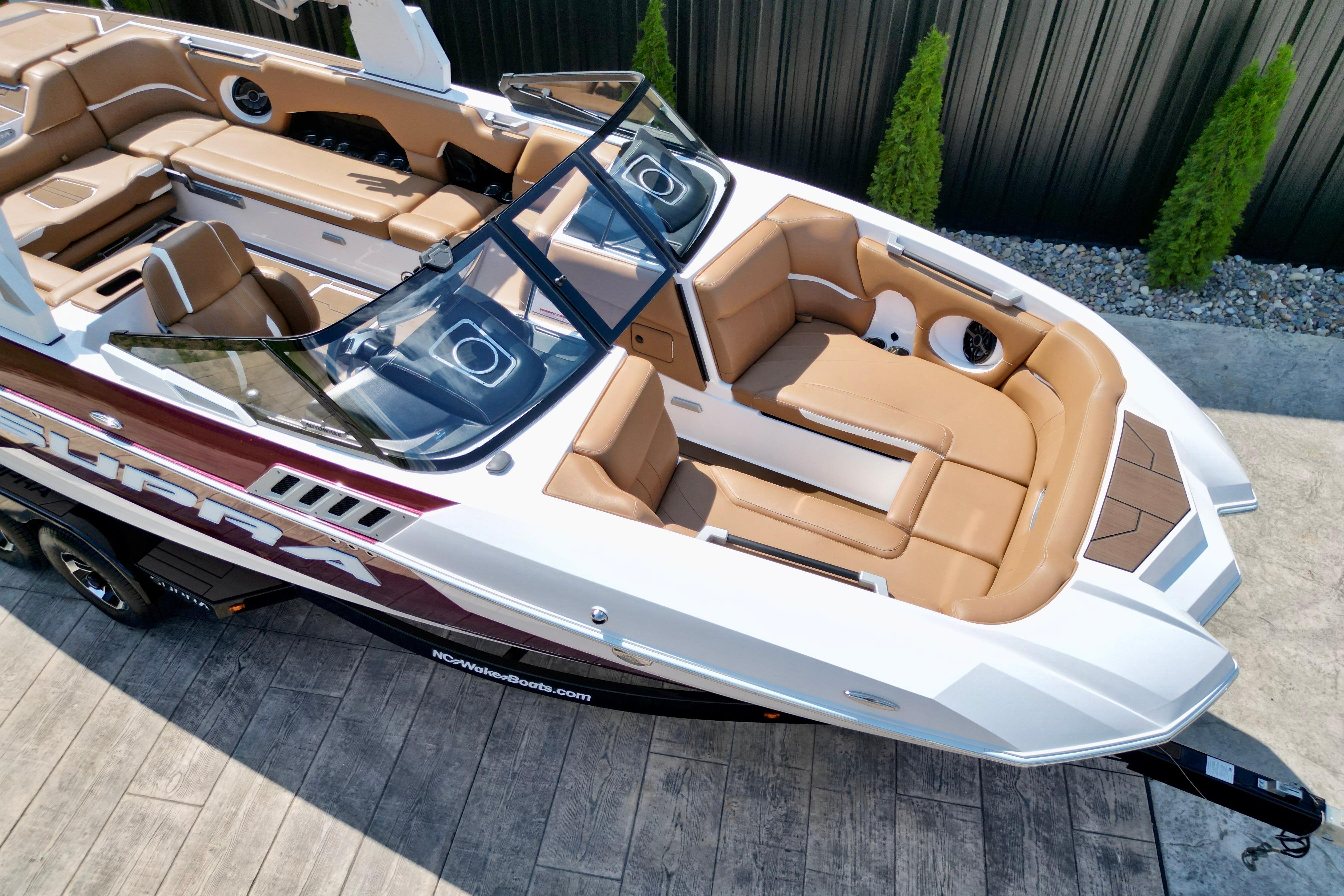 2021 Supra SE boat with luxurious tan seating and sleek design.