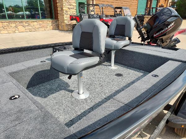 2025 Tracker Super Guide V-16 T boat interior with two gray seats and Mercury outboard motor.