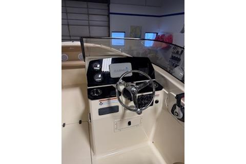 2021 Scout 215 Dorado boat interior with steering wheel and dashboard controls.